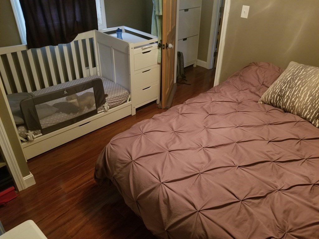 312 Anthony Fall River Fall River, MA 02721 - Photo 18 of 19 a bedroom with a bed and a rug