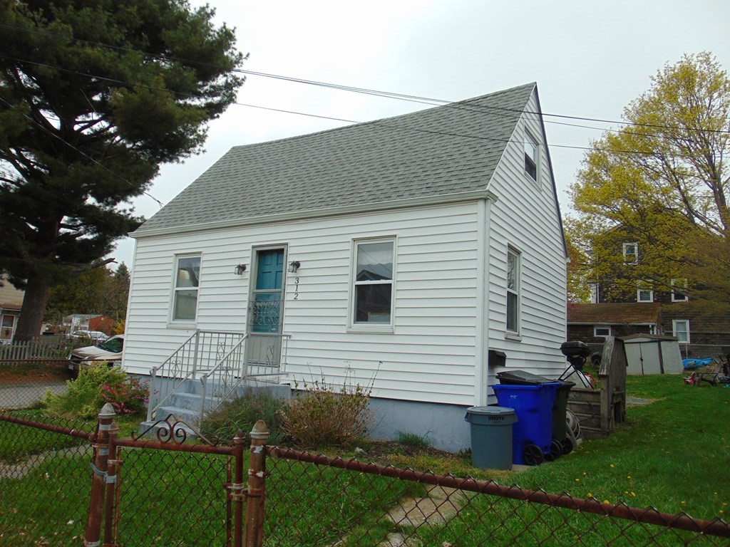 312 Anthony Fall River Fall River, MA 02721 - Photo 3 of 19 a front view of house with yard and green space