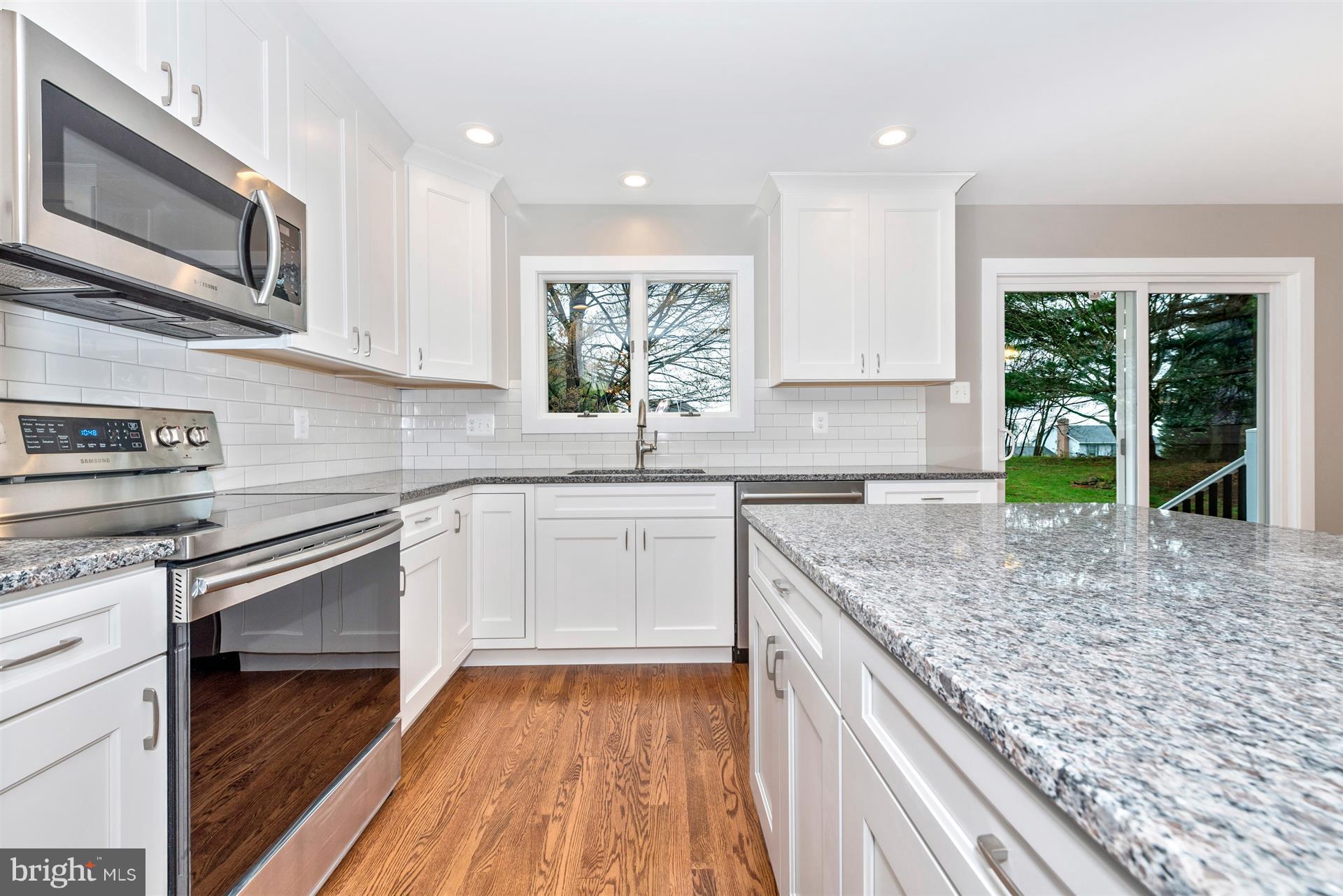 5008 Teen Barnes Road Frederick, MD 21703 - Photo 11 of 30 a kitchen with granite countertop stainless steel appliances window a sink and cabinets