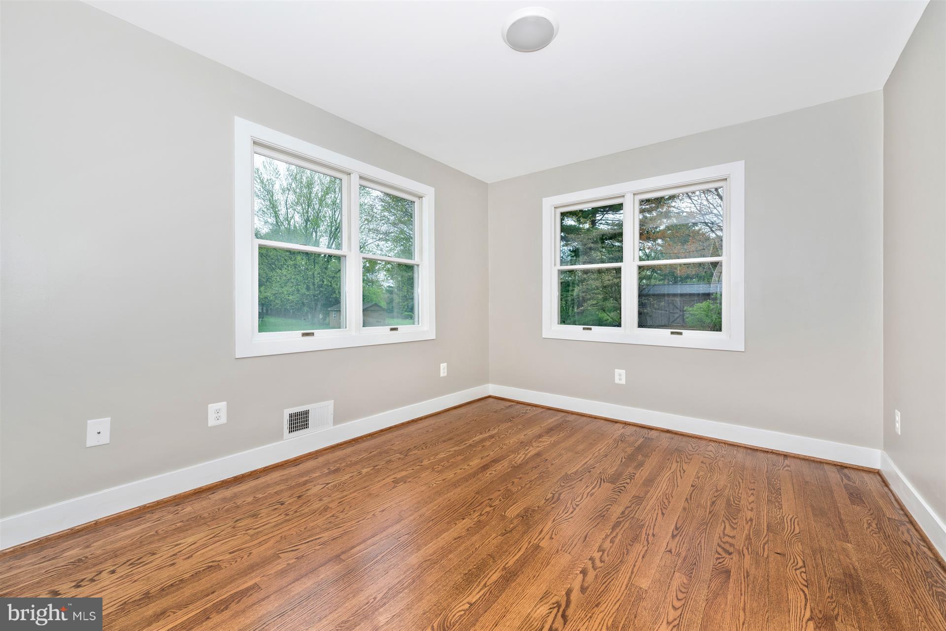 5008 Teen Barnes Road Frederick, MD 21703 - Photo 15 of 30 an empty room with wooden floor and windows