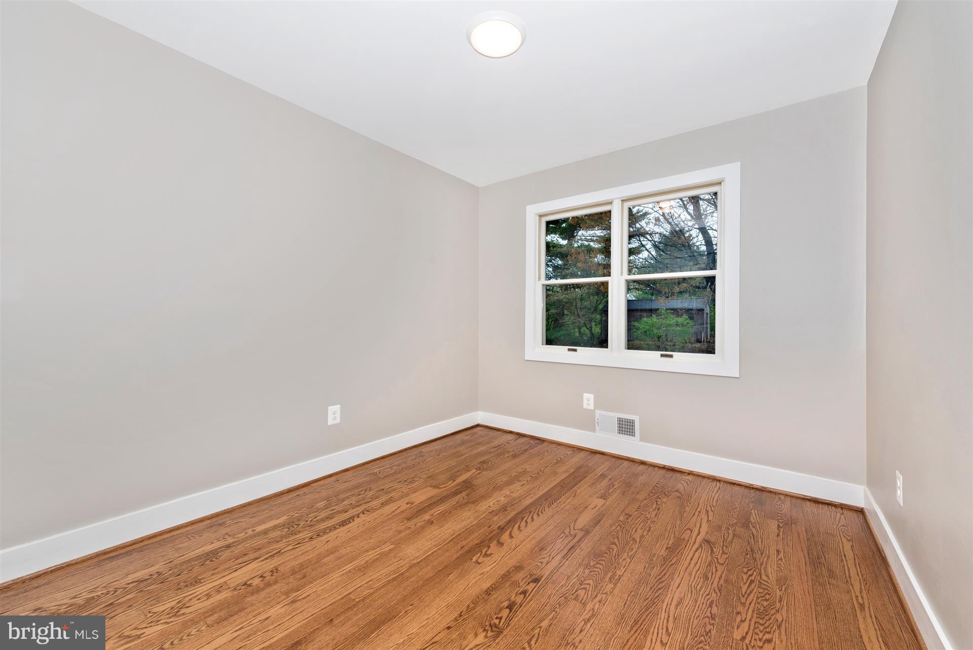 5008 Teen Barnes Road Frederick, MD 21703 - Photo 16 of 30 an empty room with wooden floor and windows