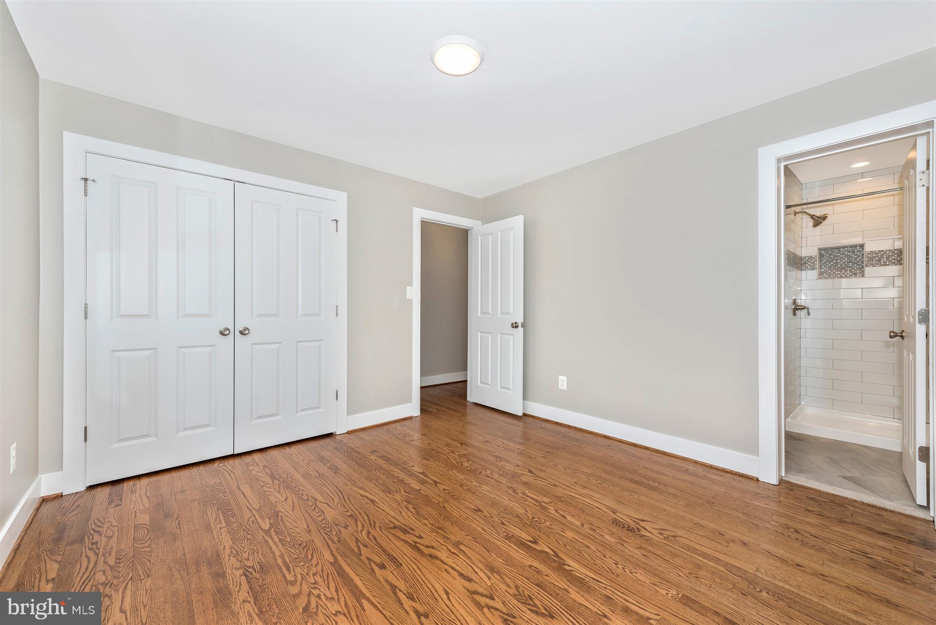 5008 Teen Barnes Road Frederick, MD 21703 - Photo 18 of 30 a view of an empty room with wooden floor