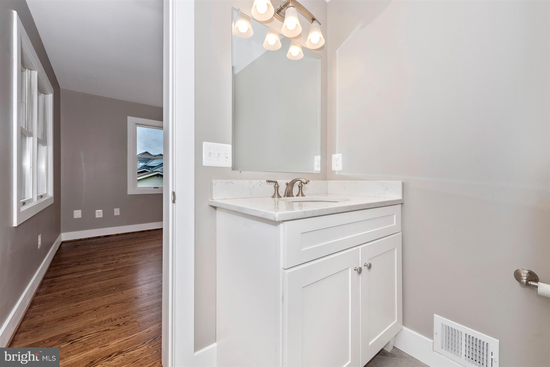 5008 Teen Barnes Road Frederick, MD 21703 - Photo 20 of 30 a bathroom with a sink vanity and a mirror