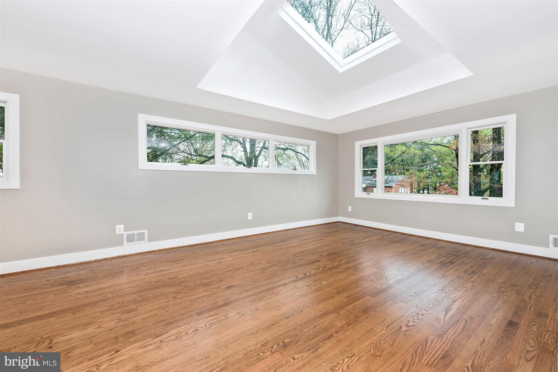 5008 Teen Barnes Road Frederick, MD 21703 - Photo 3 of 30 a view of an empty room with wooden floor and a window