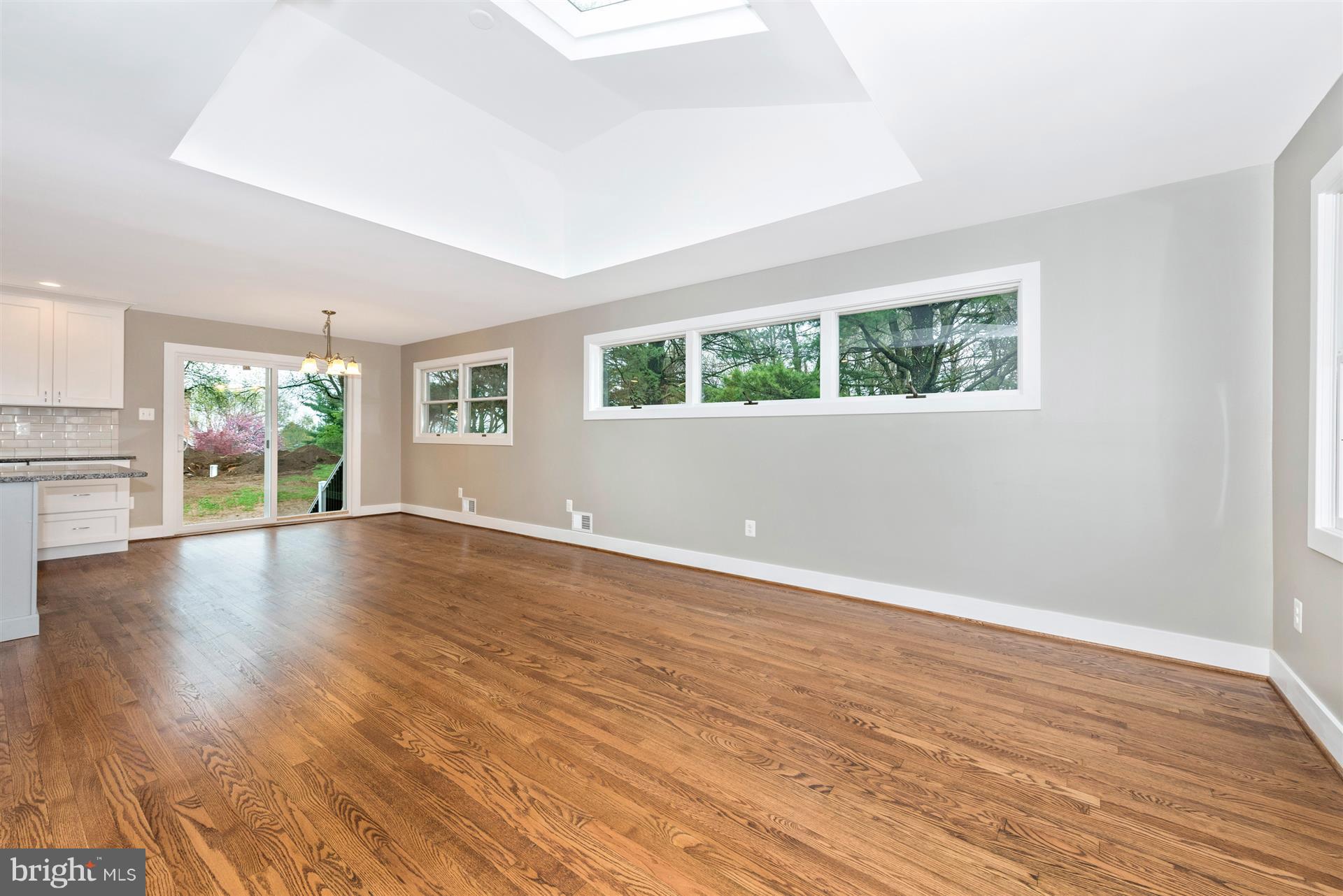 5008 Teen Barnes Road Frederick, MD 21703 - Photo 5 of 30 an empty room with wooden floor and windows