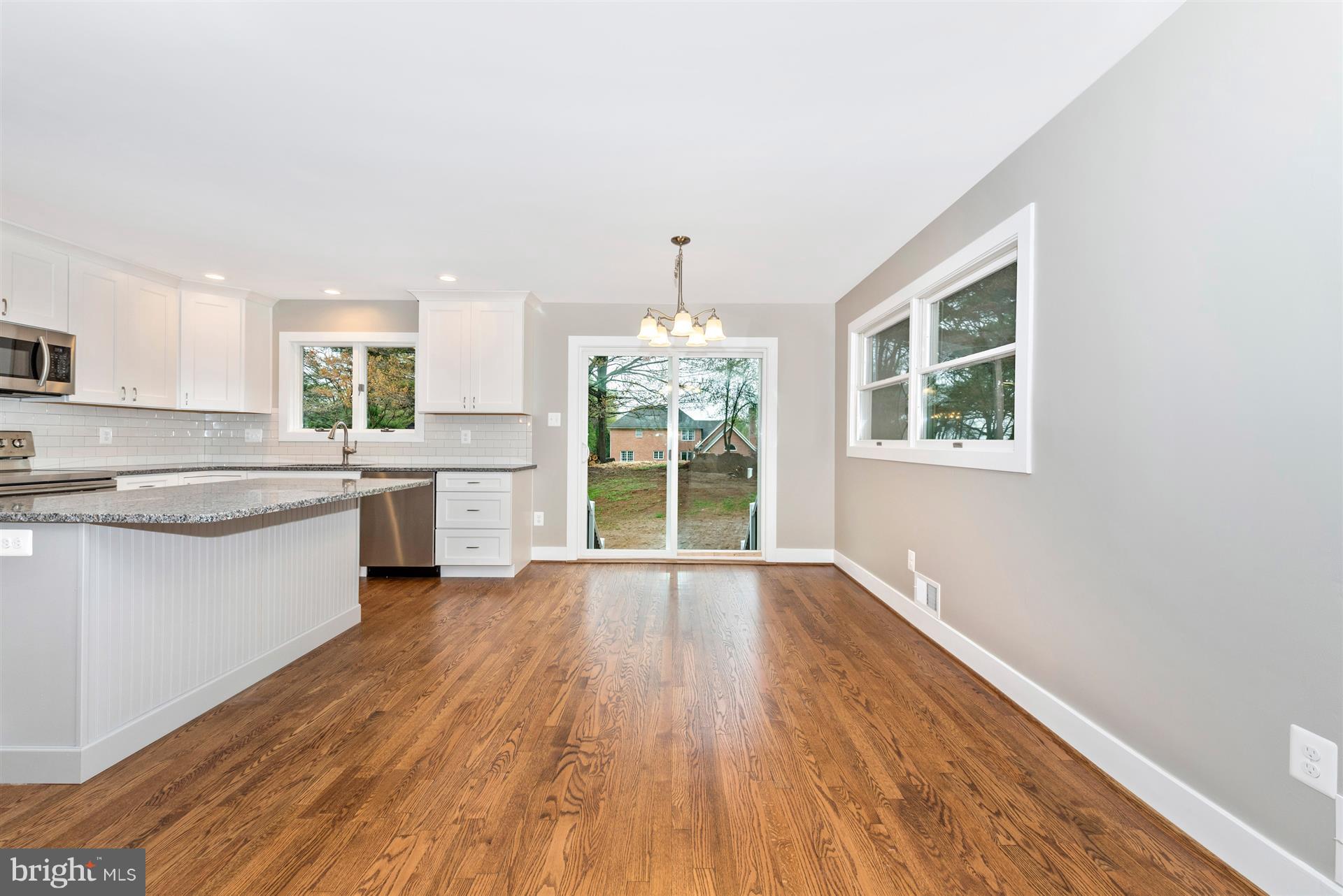 5008 Teen Barnes Road Frederick, MD 21703 - Photo 8 of 30 a view of a kitchen with wooden floor and a window