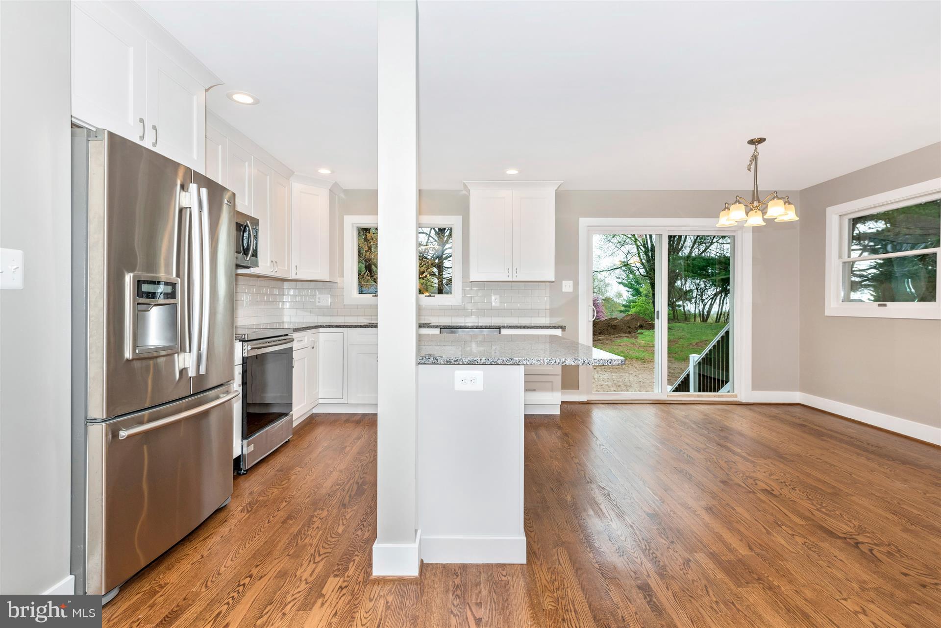 5008 Teen Barnes Road Frederick, MD 21703 - Photo 10 of 30 a kitchen with stainless steel appliances a refrigerator and wooden floor