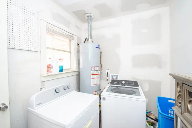 a utility room with dryer and washer