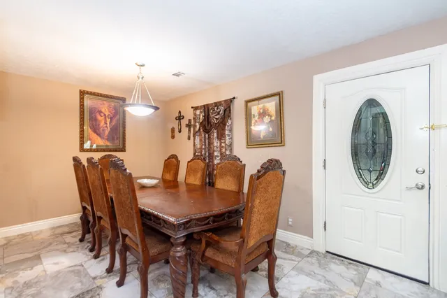 a view of a dining room with furniture