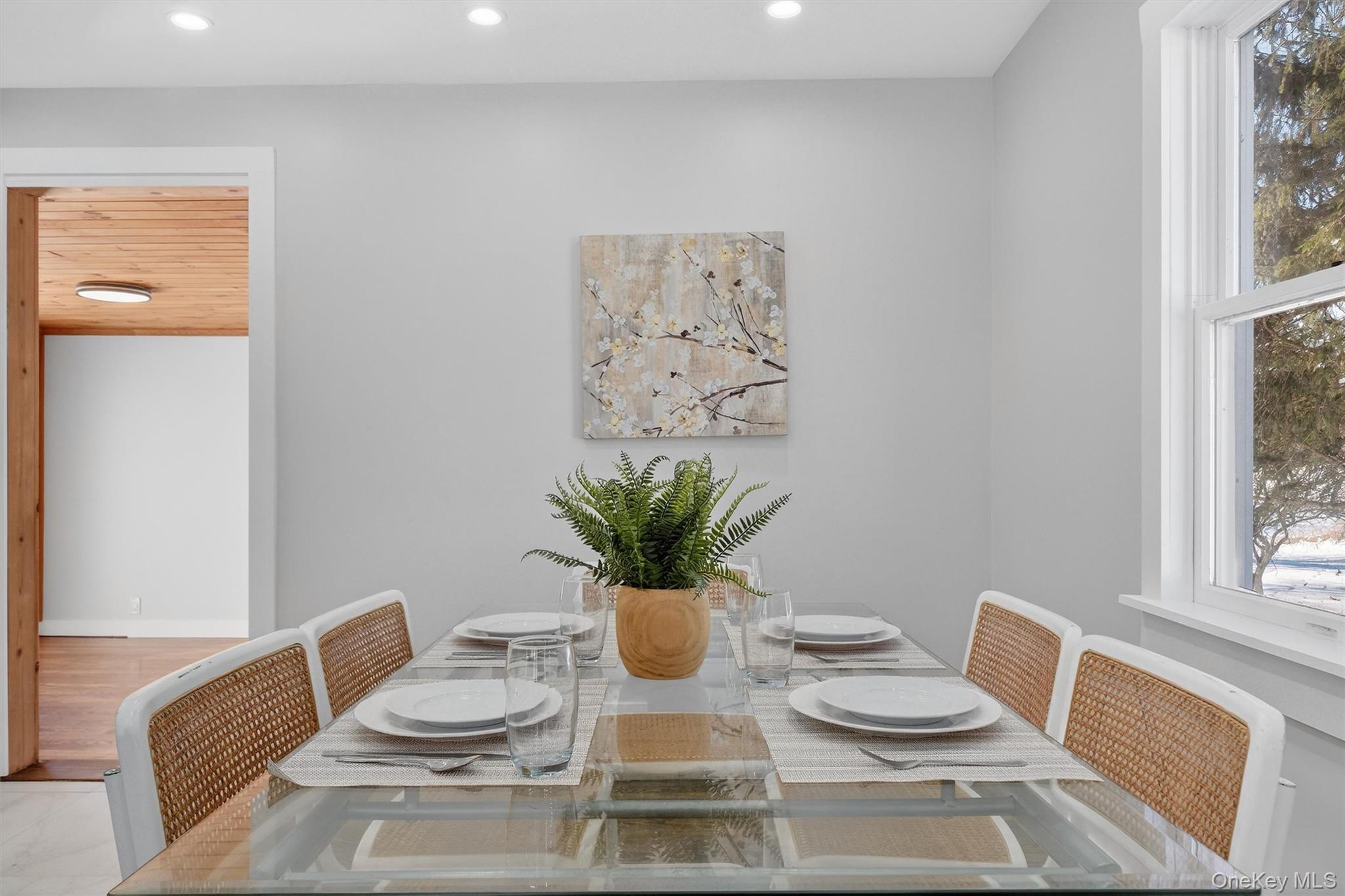 27 Franklin Road Hyde Park, NY 12538 - Photo 12 of 37 a dining room with furniture and a potted plant