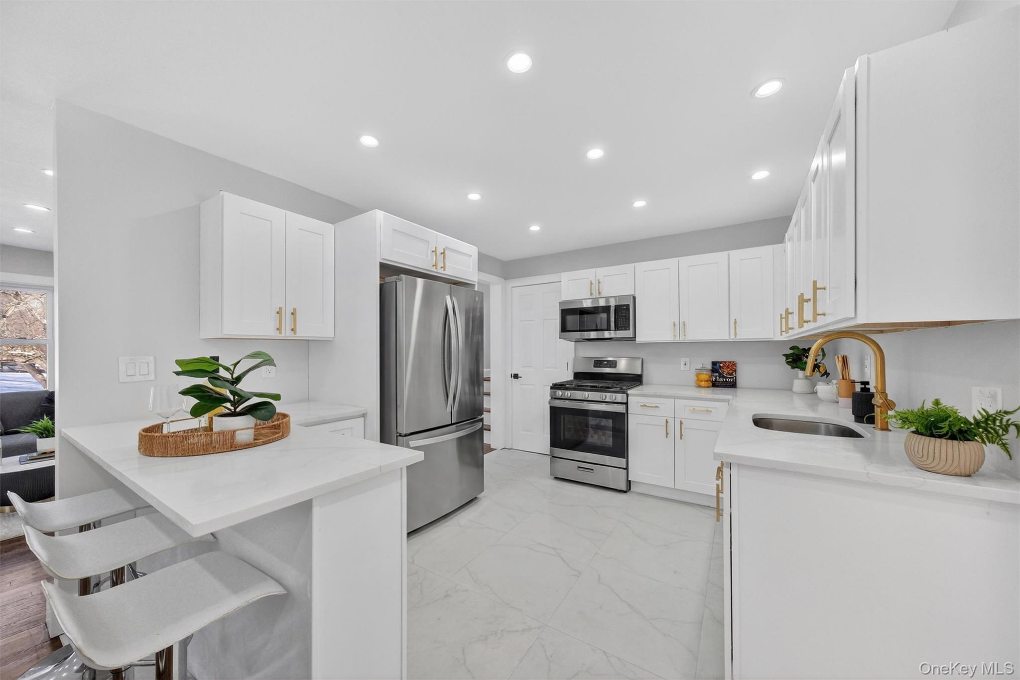 27 Franklin Road Hyde Park, NY 12538 - Photo 15 of 37 a kitchen with stainless steel appliances granite countertop a refrigerator sink stove oven and white cabinets with wooden floor