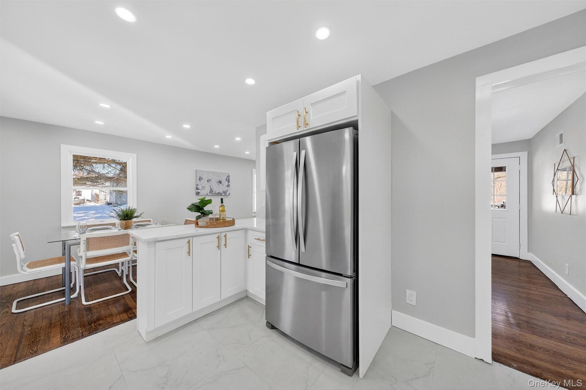 27 Franklin Road Hyde Park, NY 12538 - Photo 16 of 37 a kitchen with white cabinets and stainless steel appliances