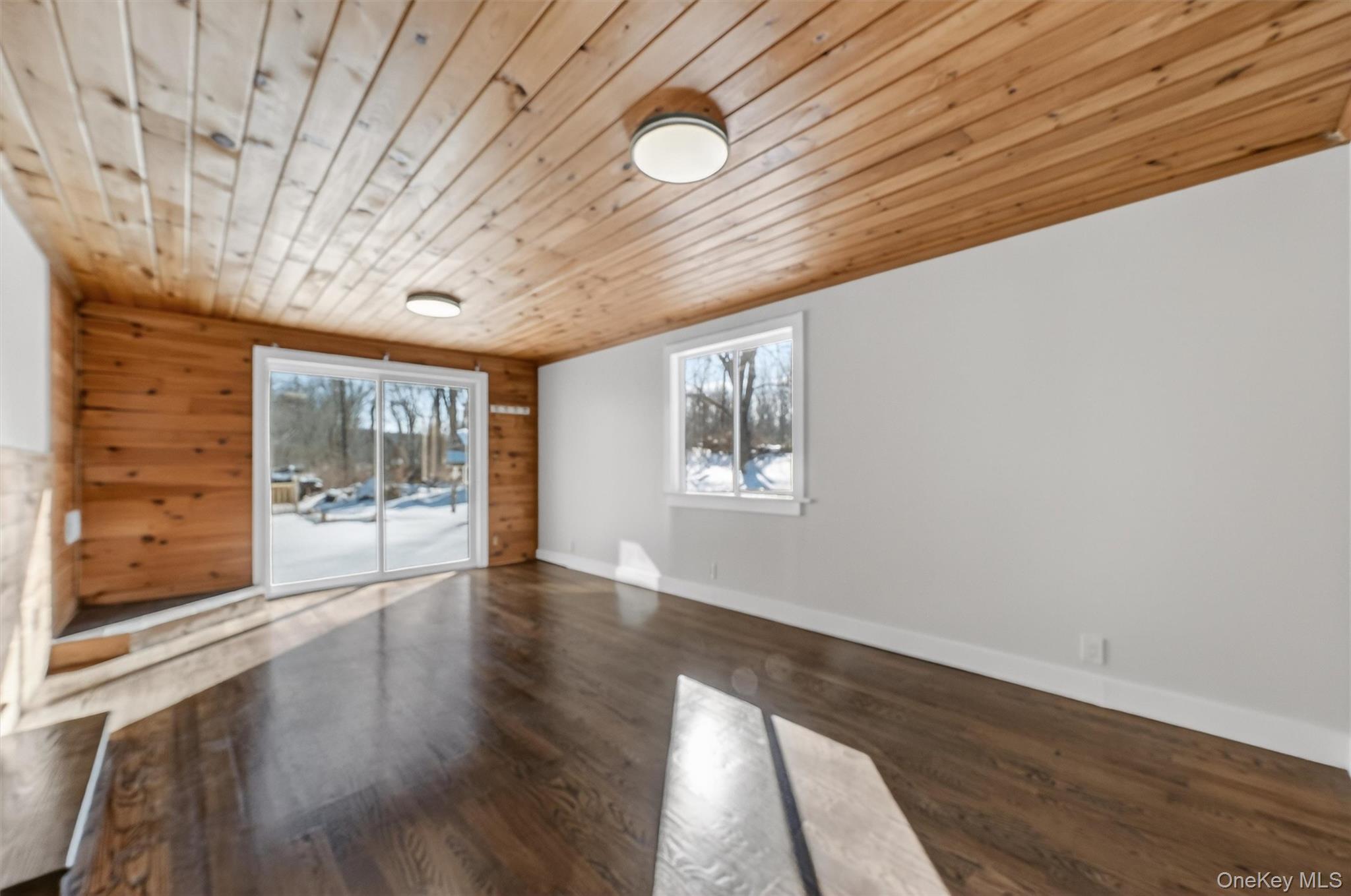 27 Franklin Road Hyde Park, NY 12538 - Photo 19 of 37 a view of an empty room with wooden floor and a window