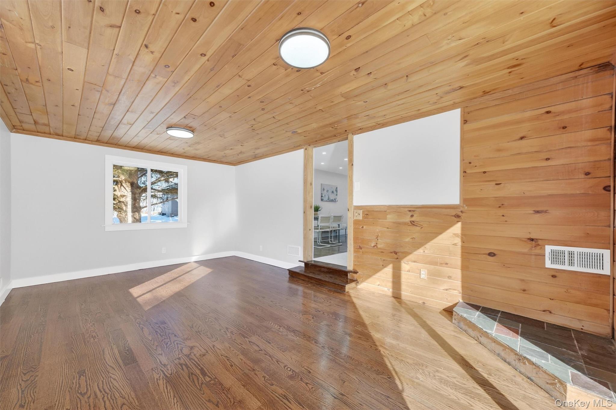 27 Franklin Road Hyde Park, NY 12538 - Photo 21 of 37 a view of an empty room with wooden floor and a window