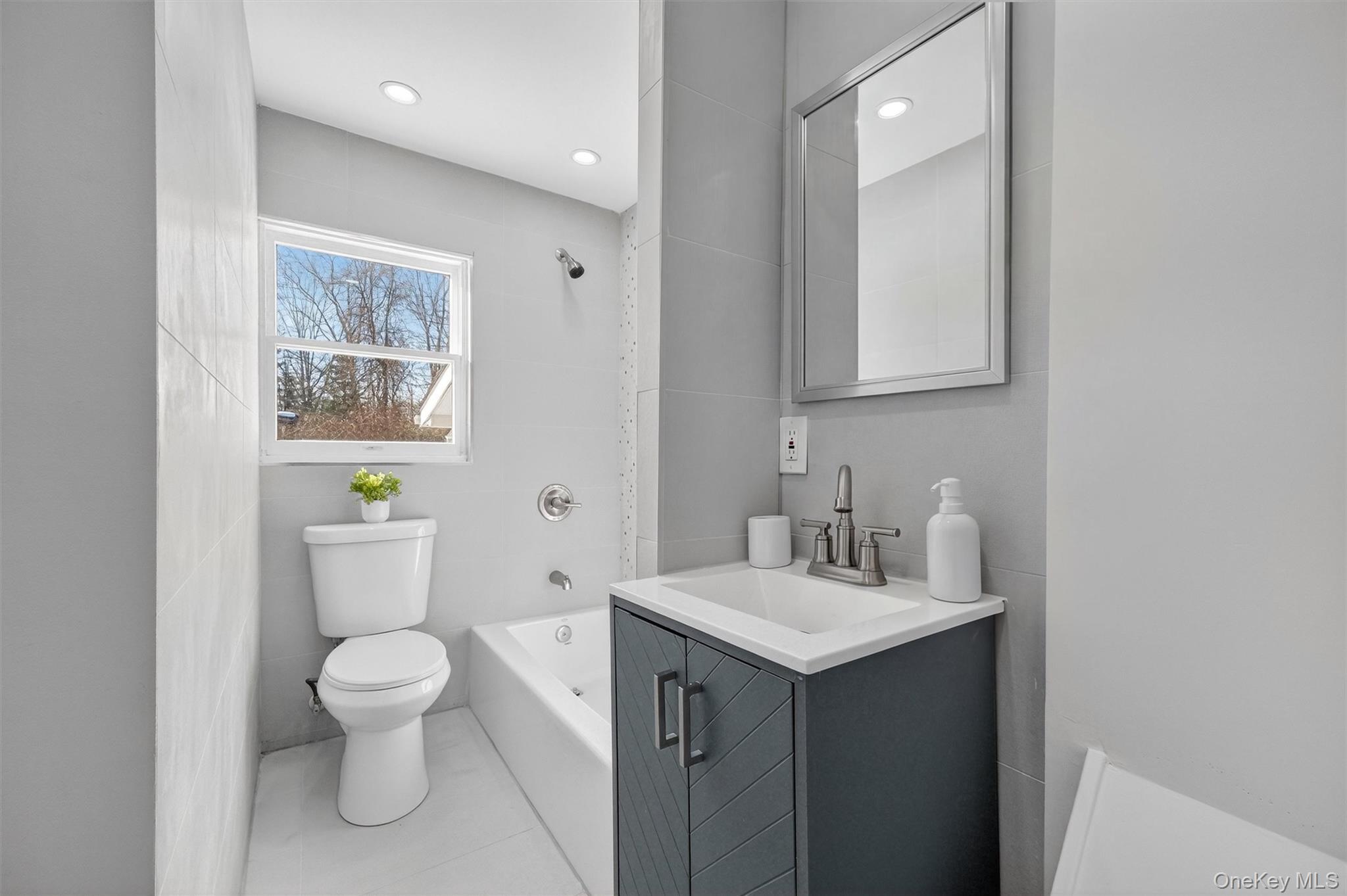 27 Franklin Road Hyde Park, NY 12538 - Photo 22 of 37 a bathroom with a toilet sink and mirror