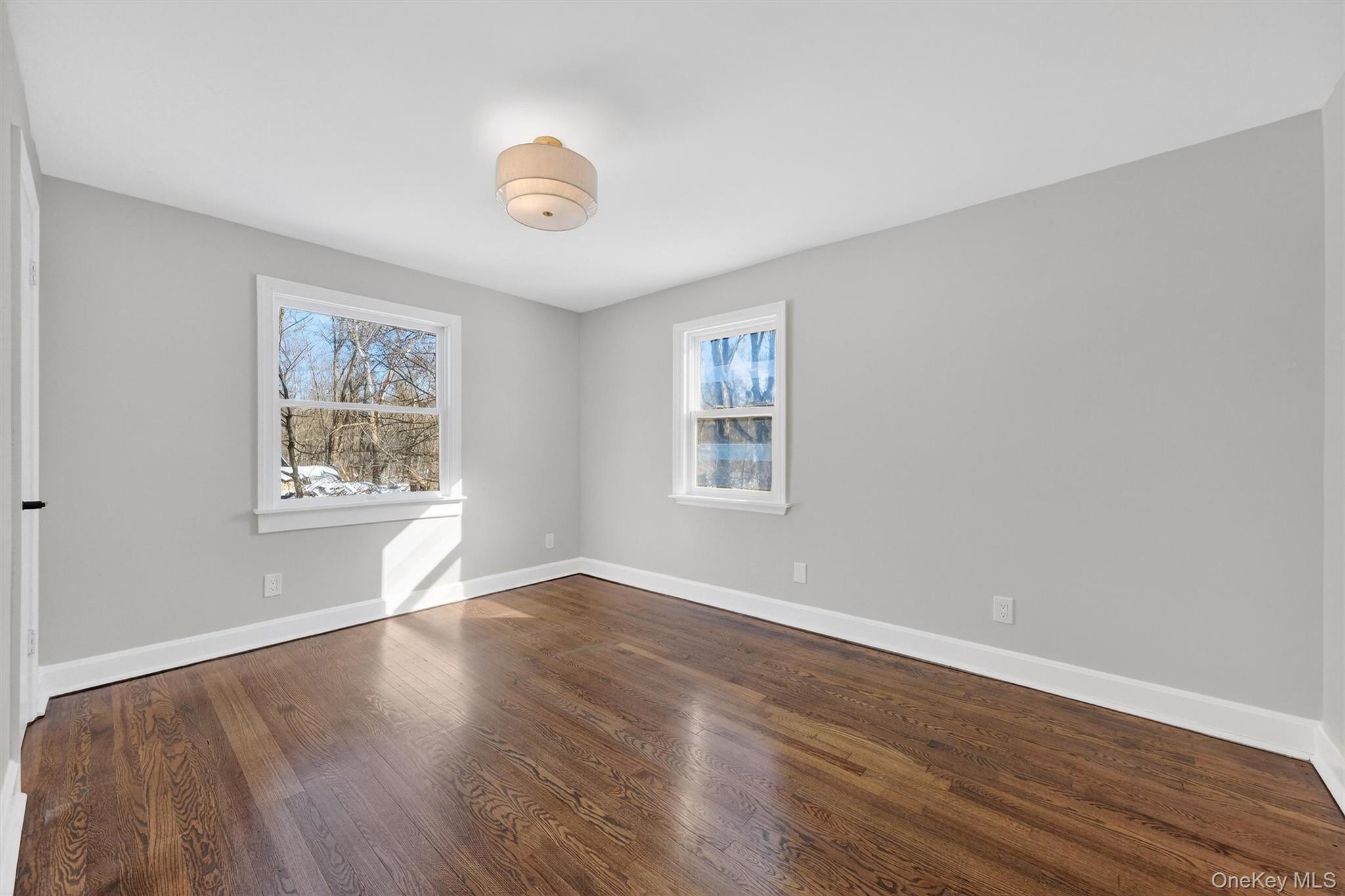 27 Franklin Road Hyde Park, NY 12538 - Photo 26 of 37 a view of an empty room with wooden floor and a window