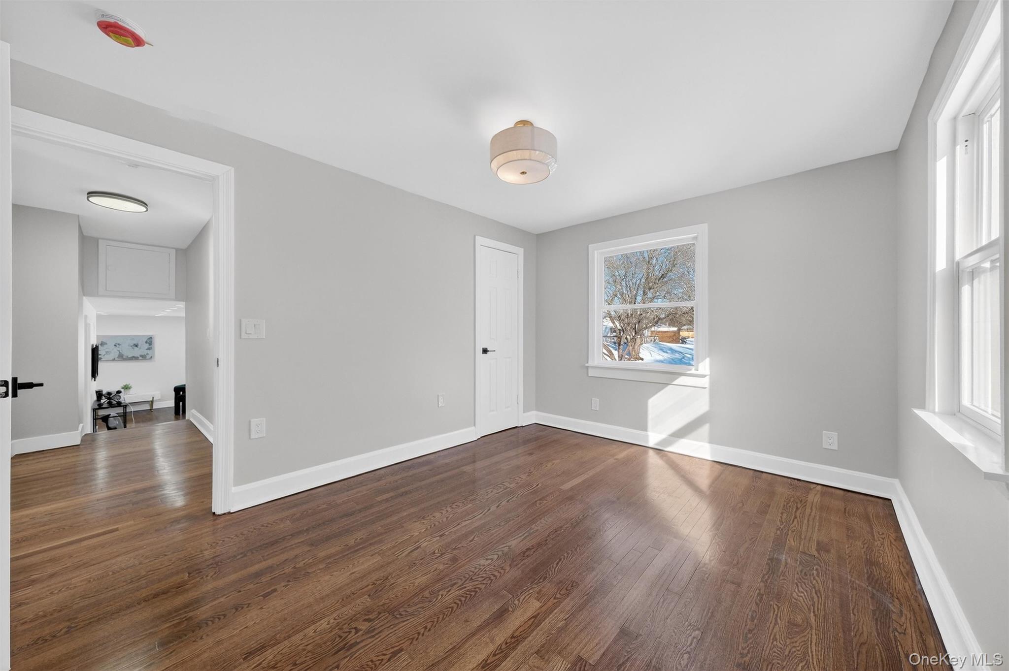27 Franklin Road Hyde Park, NY 12538 - Photo 27 of 37 a view of an empty room with wooden floor and a window