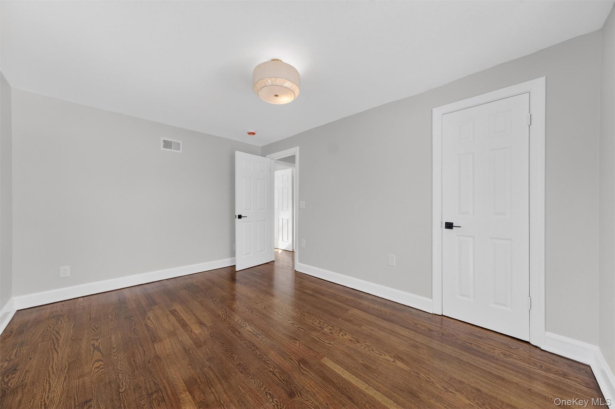 27 Franklin Road Hyde Park, NY 12538 - Photo 28 of 37 a view of an empty room with wooden floor
