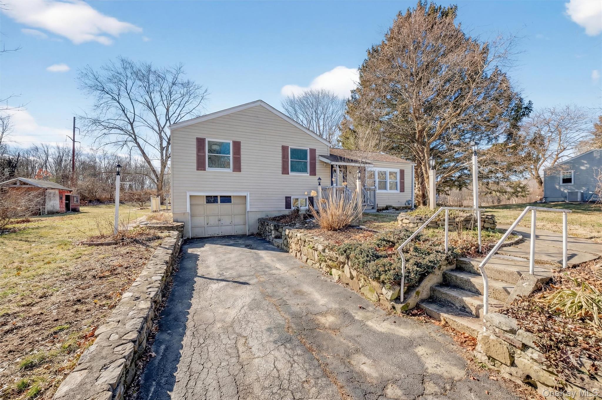 27 Franklin Road Hyde Park, NY 12538 - Photo 4 of 37 a view of a house with a yard covered in snow