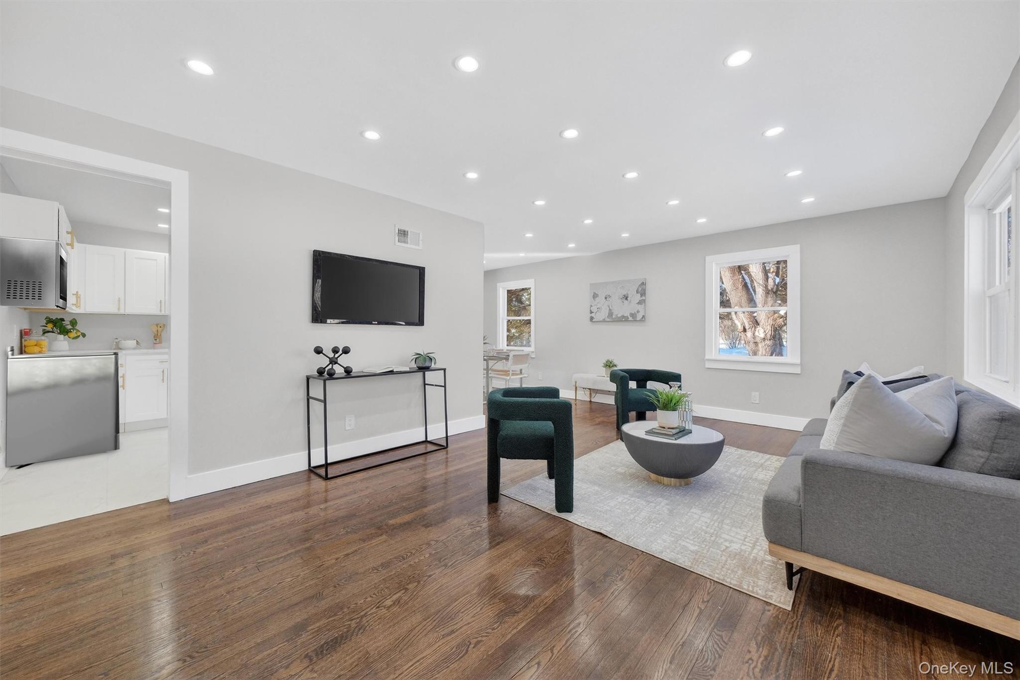 27 Franklin Road Hyde Park, NY 12538 - Photo 5 of 37 a living room with furniture and a flat screen tv