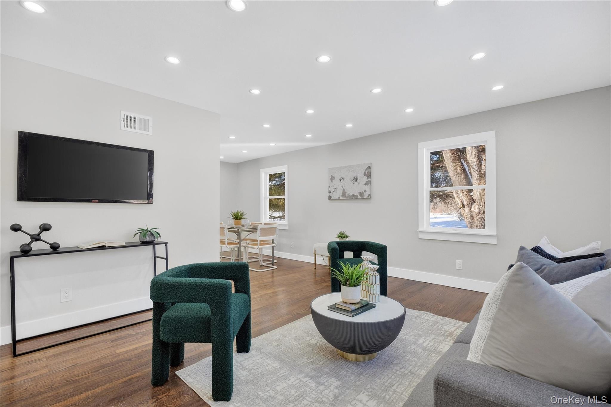 27 Franklin Road Hyde Park, NY 12538 - Photo 8 of 37 a living room with furniture and a flat screen tv