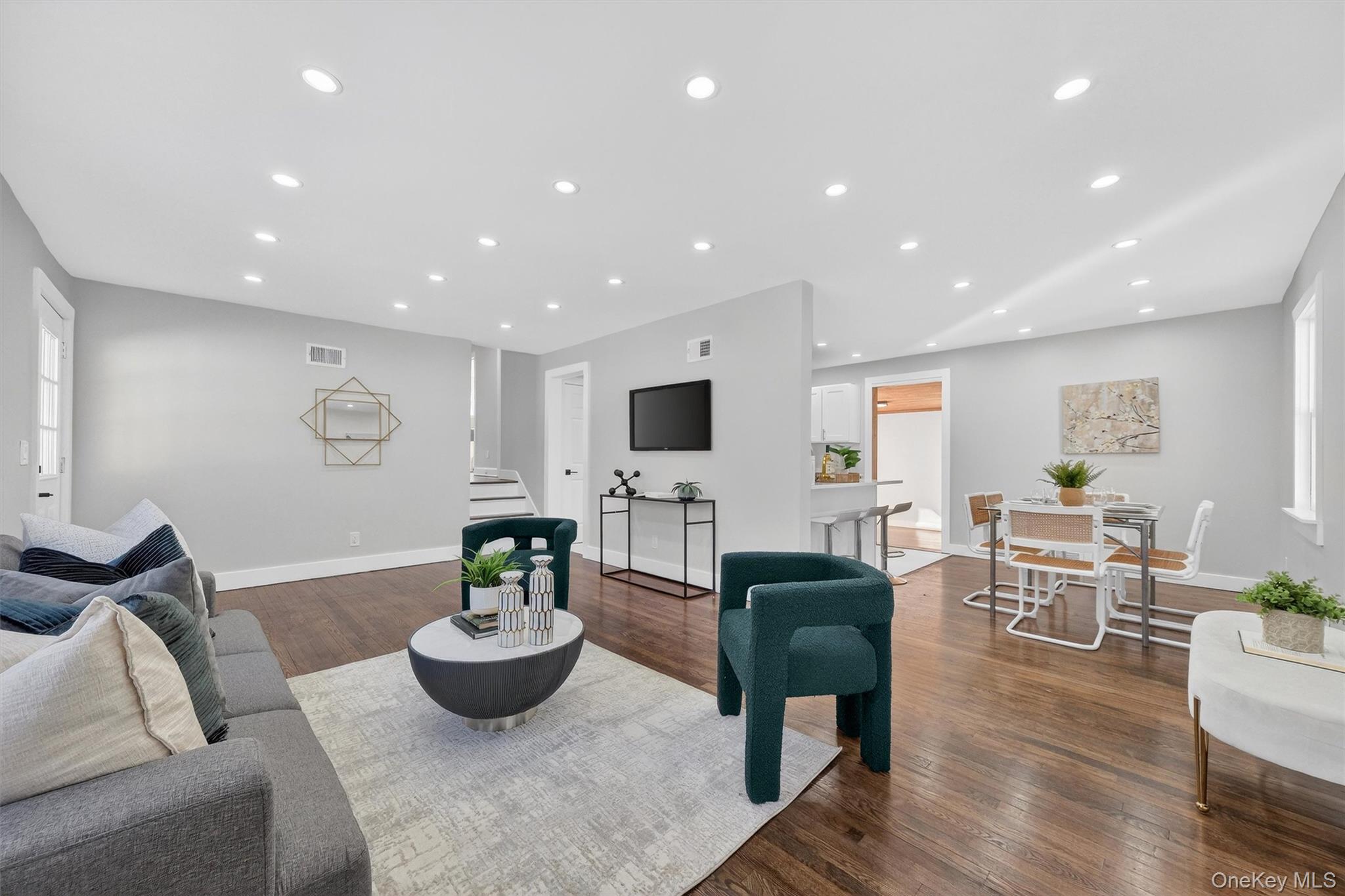 27 Franklin Road Hyde Park, NY 12538 - Photo 9 of 37 a living room with furniture potted plant and a flat screen tv