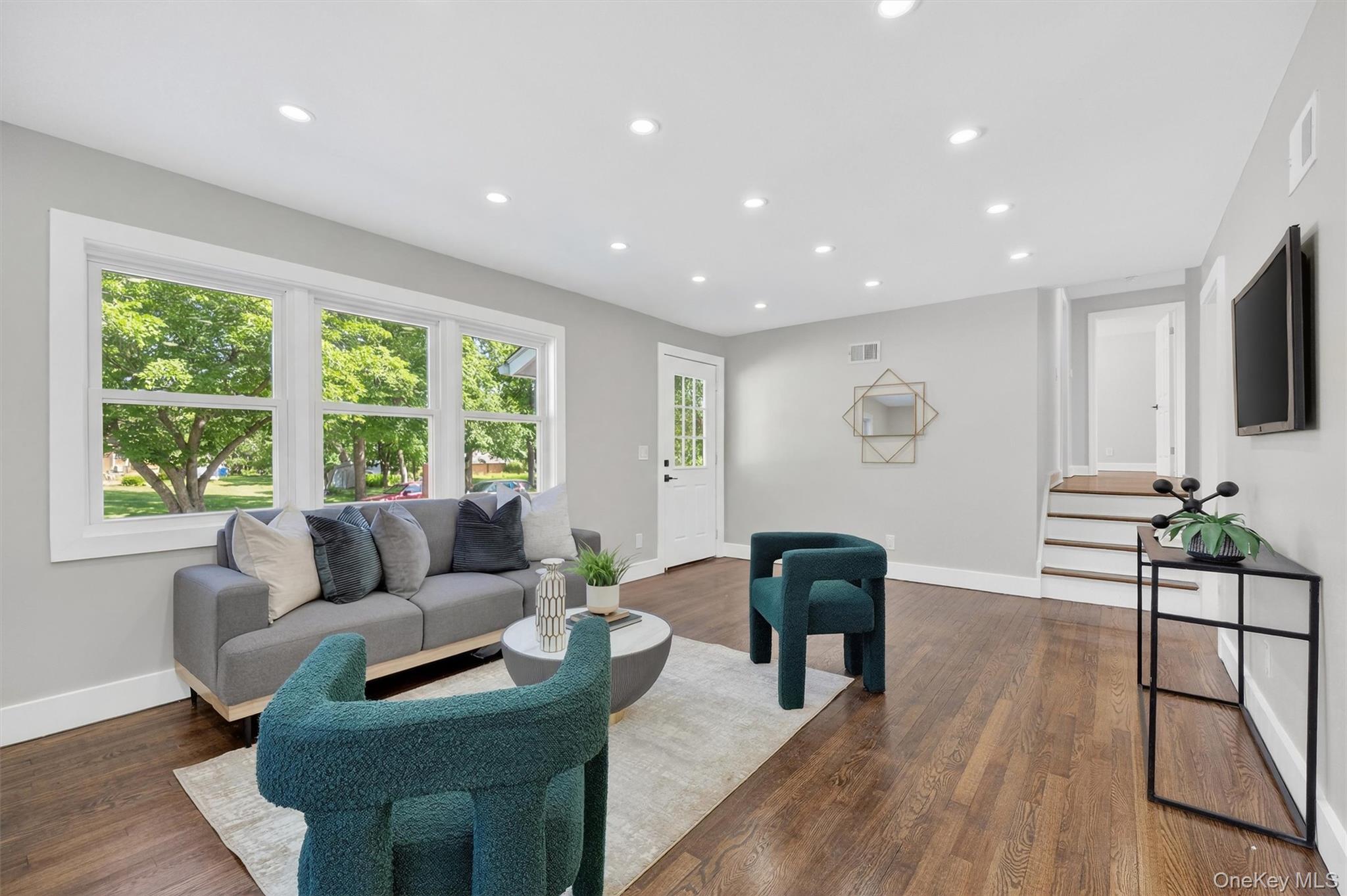 27 Franklin Road Hyde Park, NY 12538 - Photo 10 of 37 a living room with furniture and a large window