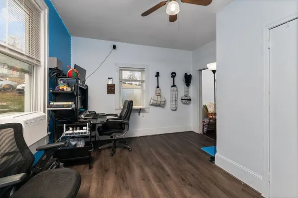 a room with furniture and wooden floor