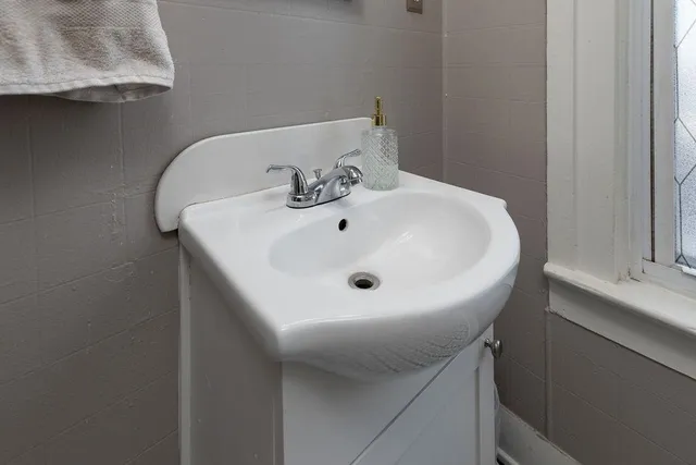 a white sink sitting next to a white sink