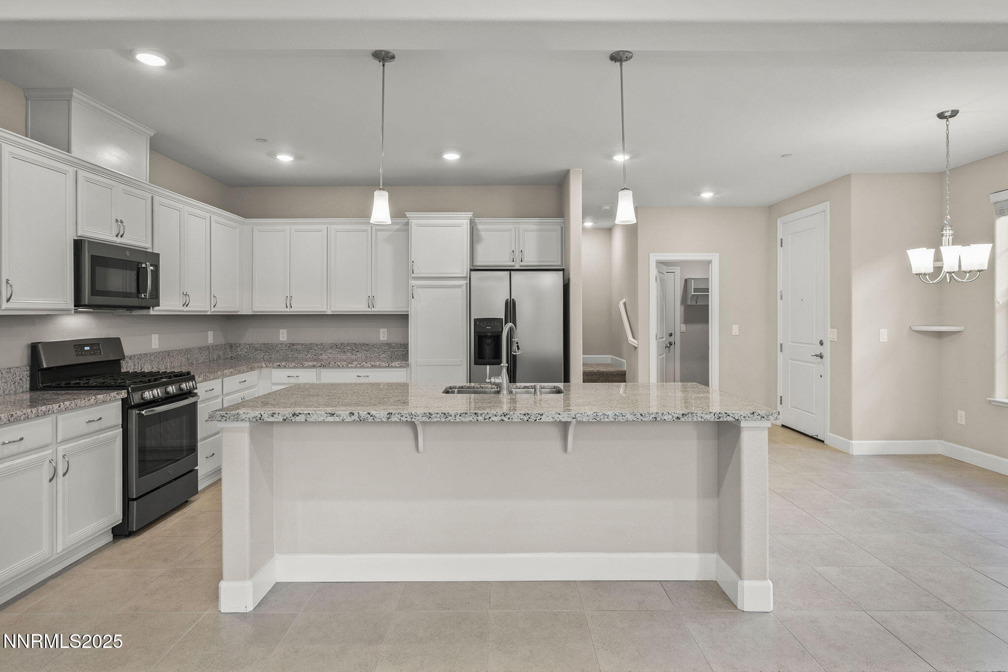 1875 Sea Horse Road, Unit C Reno, NV 89521 - Photo 11 of 39 a large kitchen with granite countertop a large counter top appliances and cabinets
