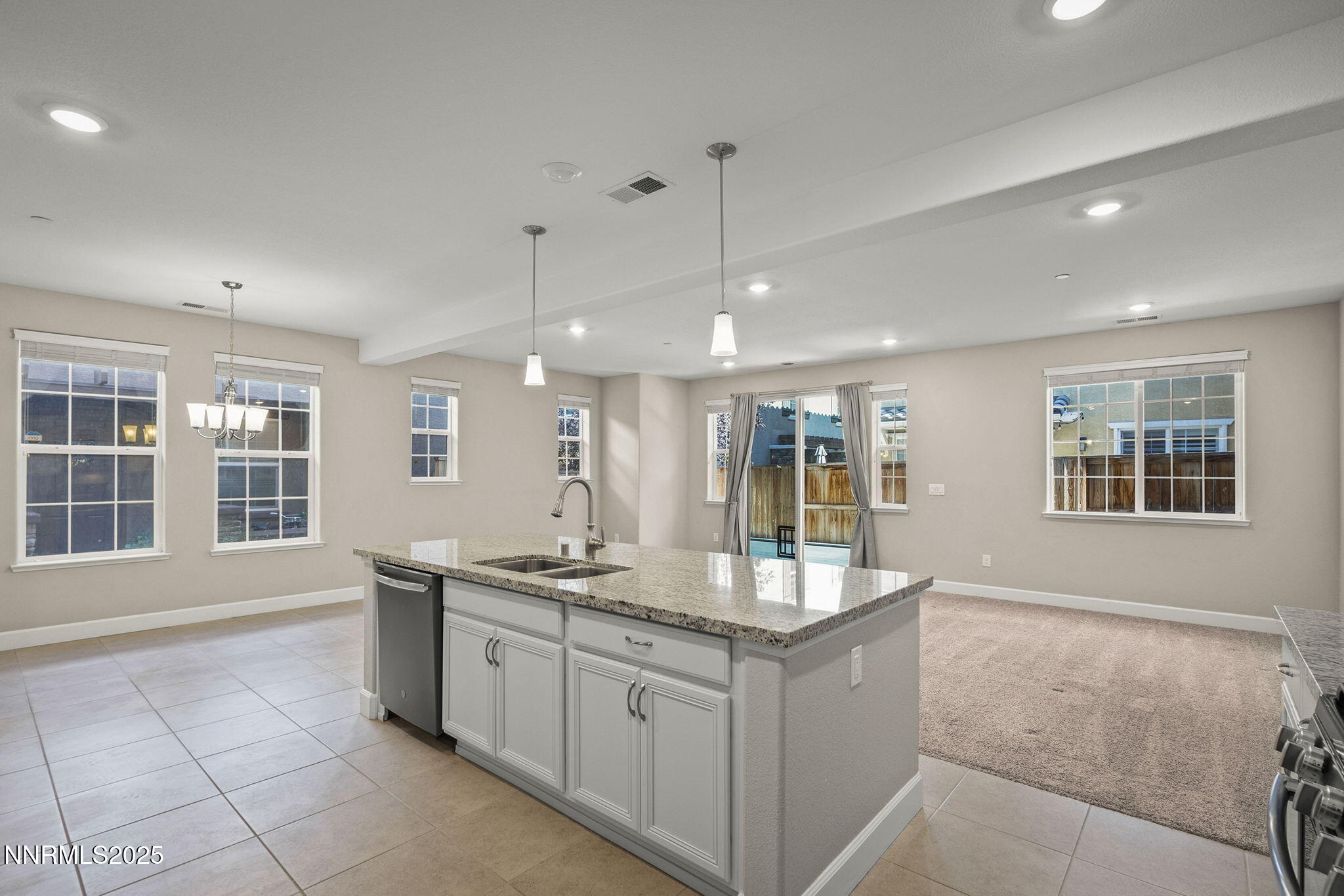 1875 Sea Horse Road, Unit C Reno, NV 89521 - Photo 12 of 39 a kitchen with a sink stove and cabinets