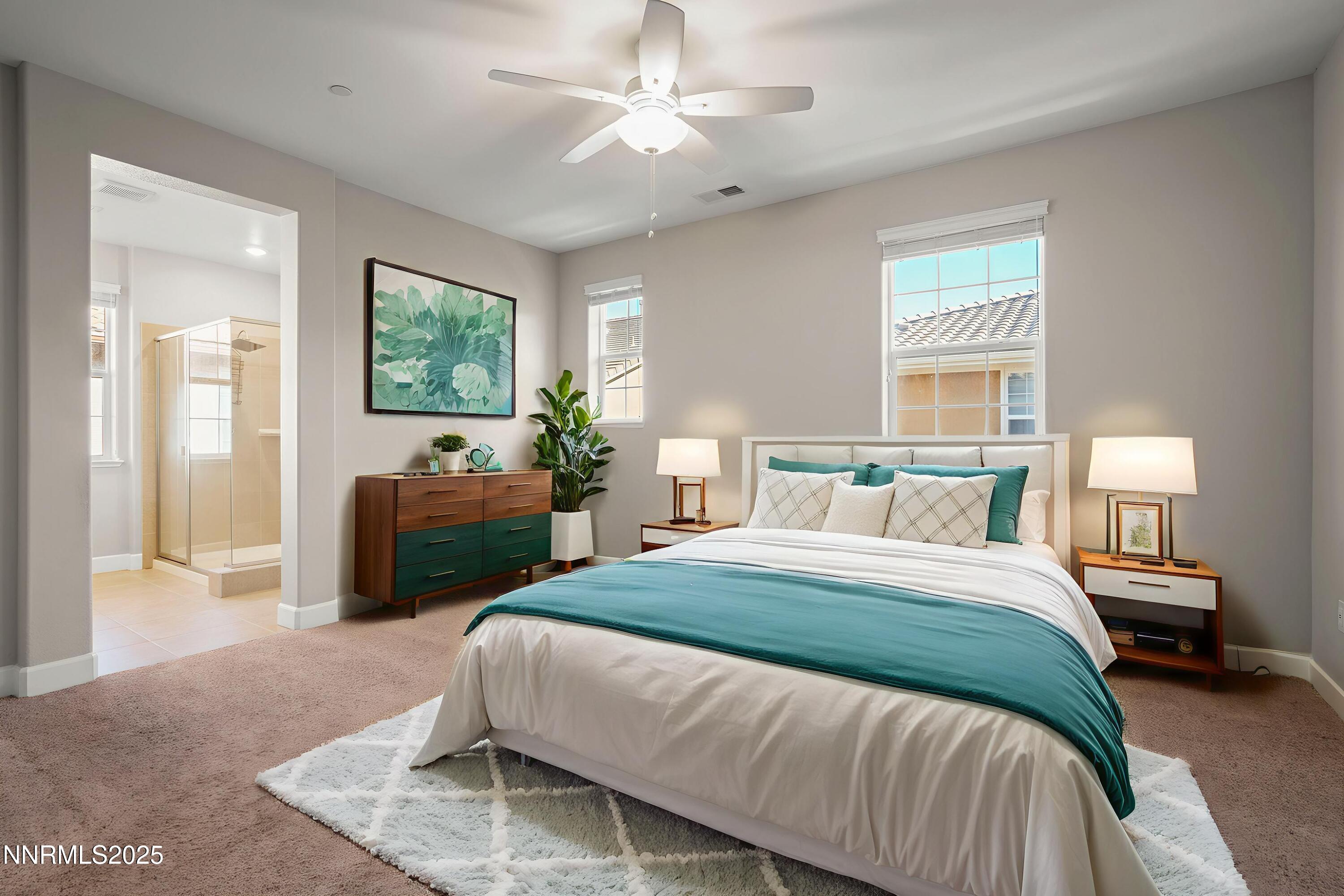 1875 Sea Horse Road, Unit C Reno, NV 89521 - Photo 16 of 39 a spacious bedroom with a bed and a couch