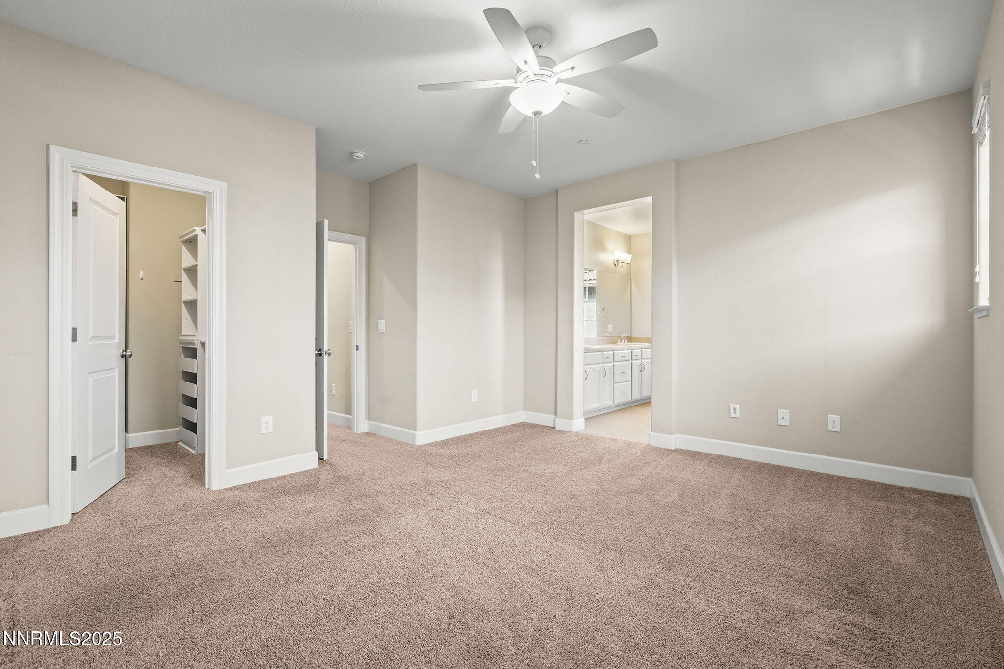 1875 Sea Horse Road, Unit C Reno, NV 89521 - Photo 18 of 39 an empty room with closet and a ceiling fan