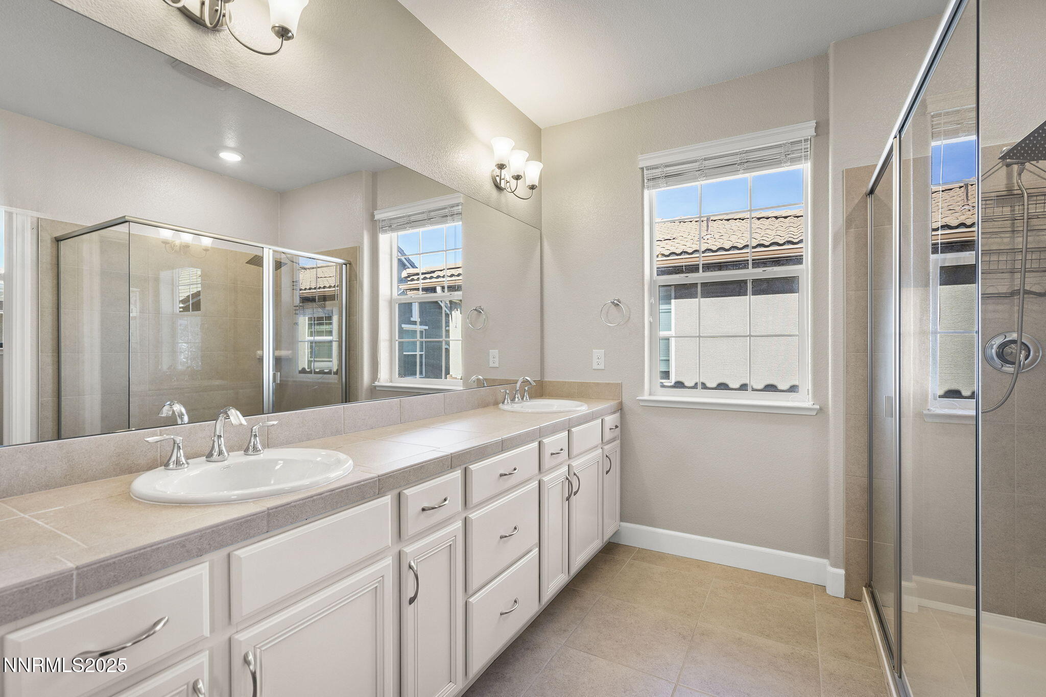 1875 Sea Horse Road, Unit C Reno, NV 89521 - Photo 20 of 39 a bathroom with a sink double vanity and a shower