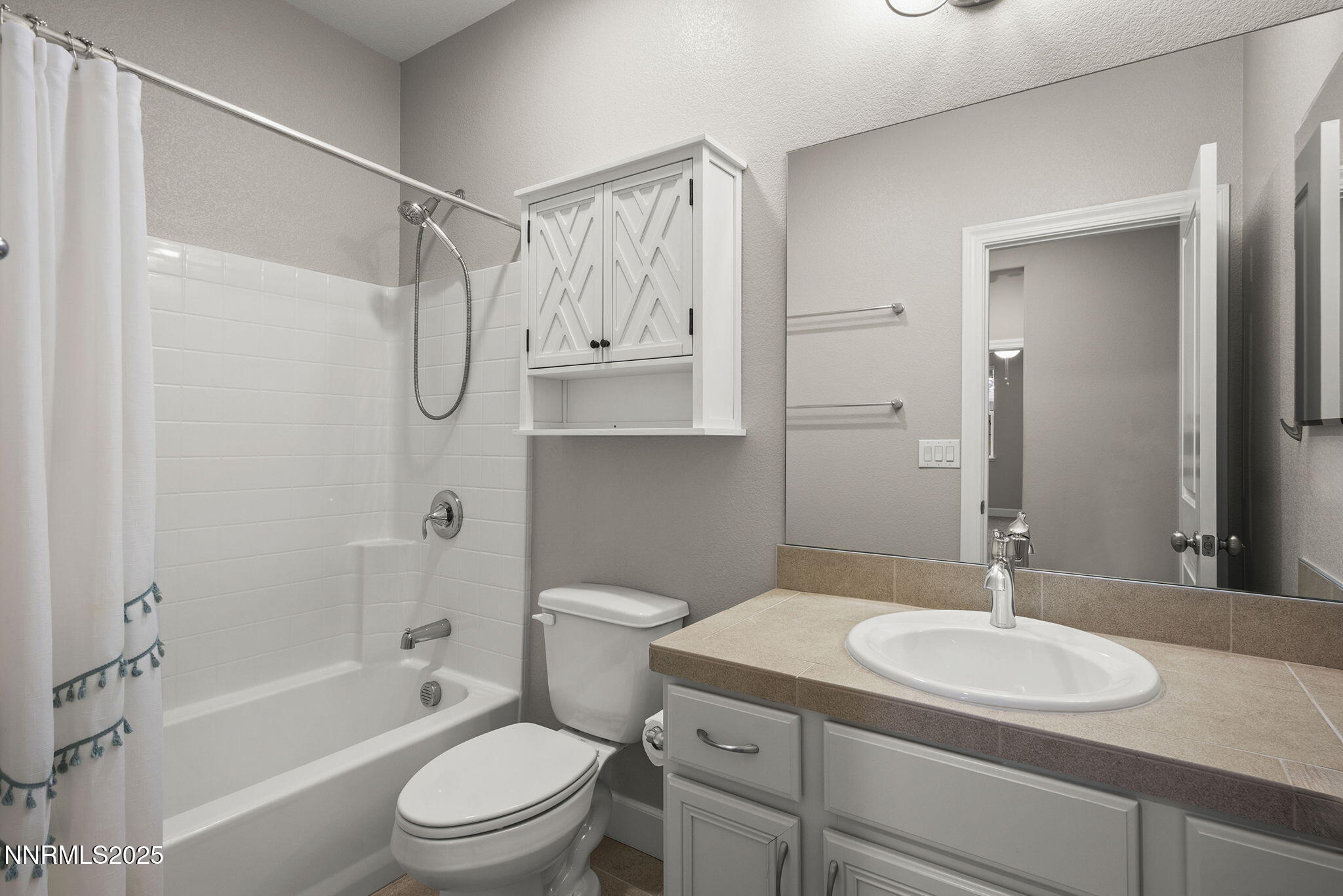 1875 Sea Horse Road, Unit C Reno, NV 89521 - Photo 24 of 39 a bathroom with a granite countertop sink toilet and shower