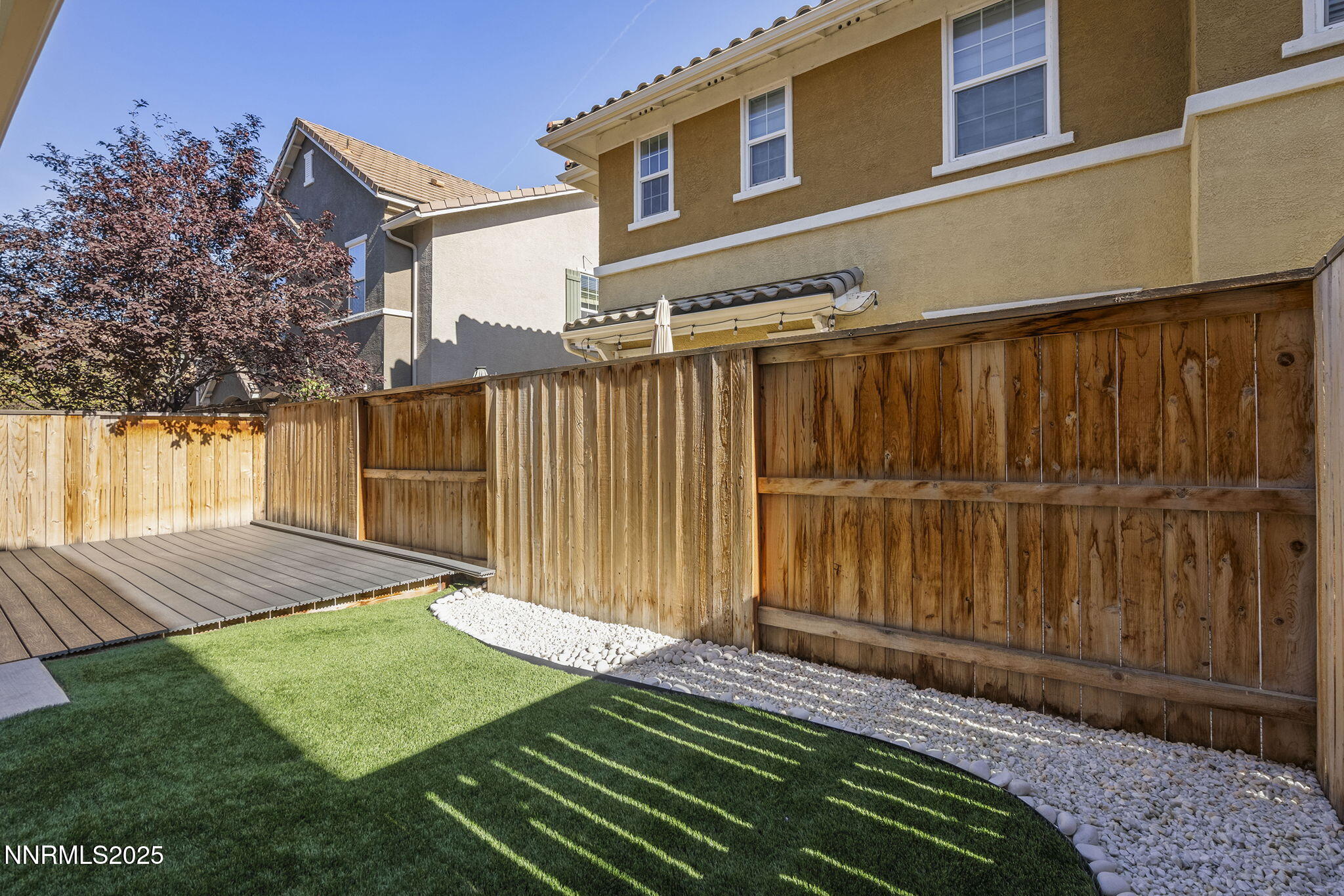 1875 Sea Horse Road, Unit C Reno, NV 89521 - Photo 30 of 39 a view of a backyard with wooden fence