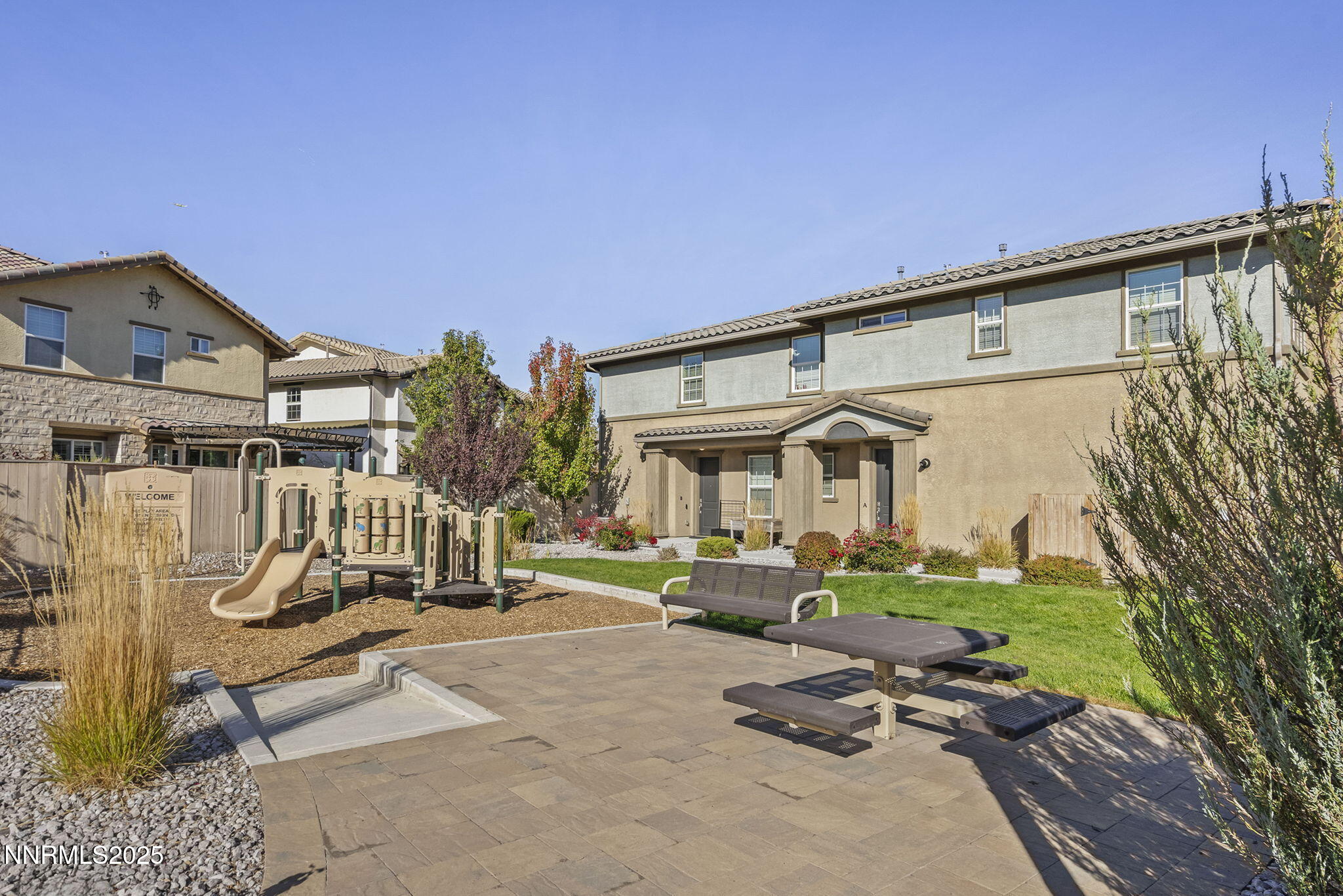 1875 Sea Horse Road, Unit C Reno, NV 89521 - Photo 36 of 39 a front view of a house with a garden