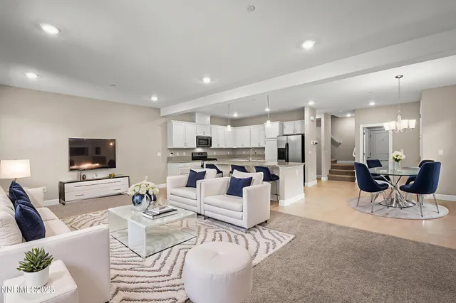 a view of an empty room with a kitchen