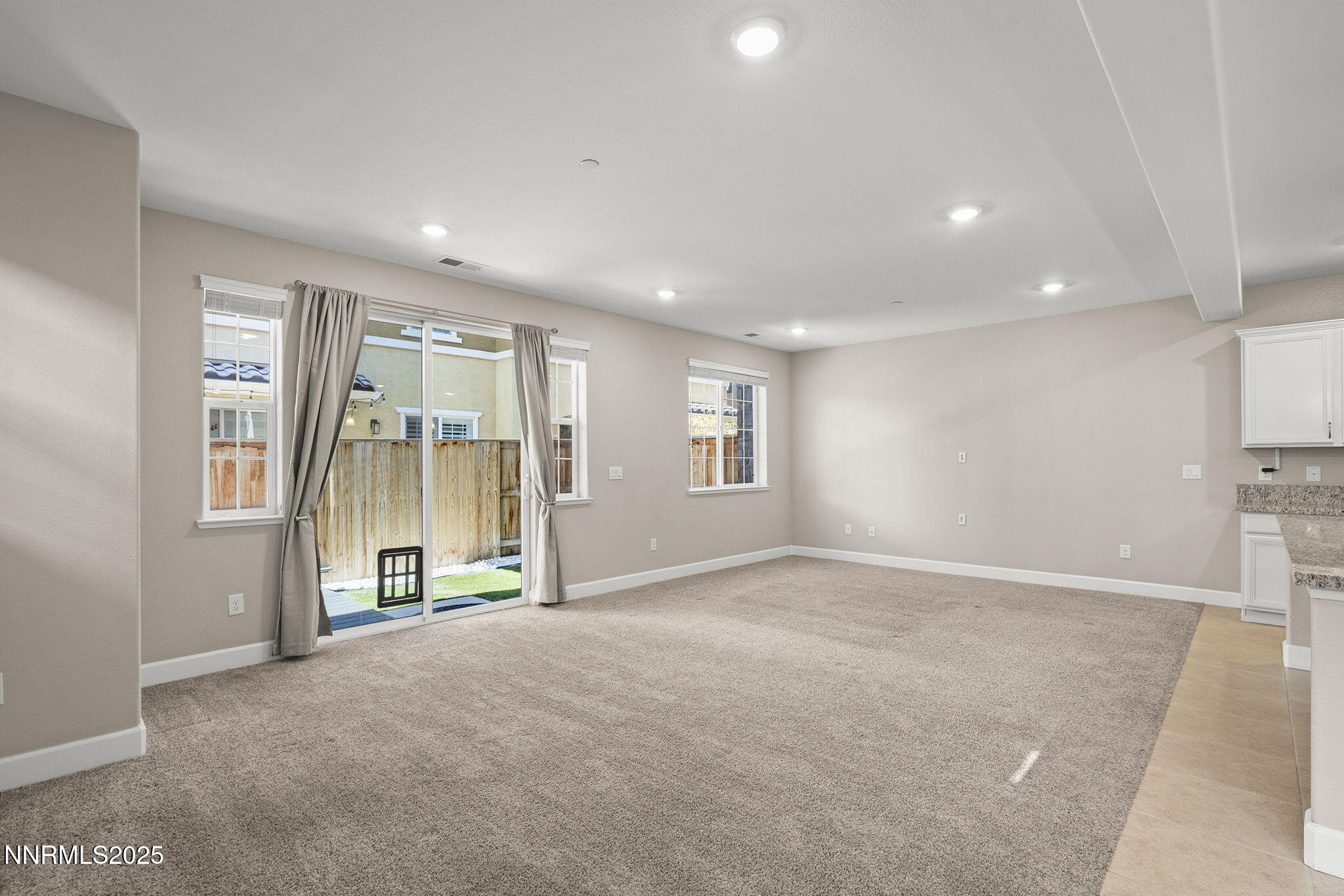 1875 Sea Horse Road, Unit C Reno, NV 89521 - Photo 7 of 39 an empty room with windows and pillars in it