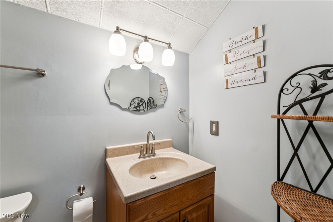 12422 Portage Street Rittman, OH 44270 - Photo 25 of 42 Half bathroom featuring vanity and toilet