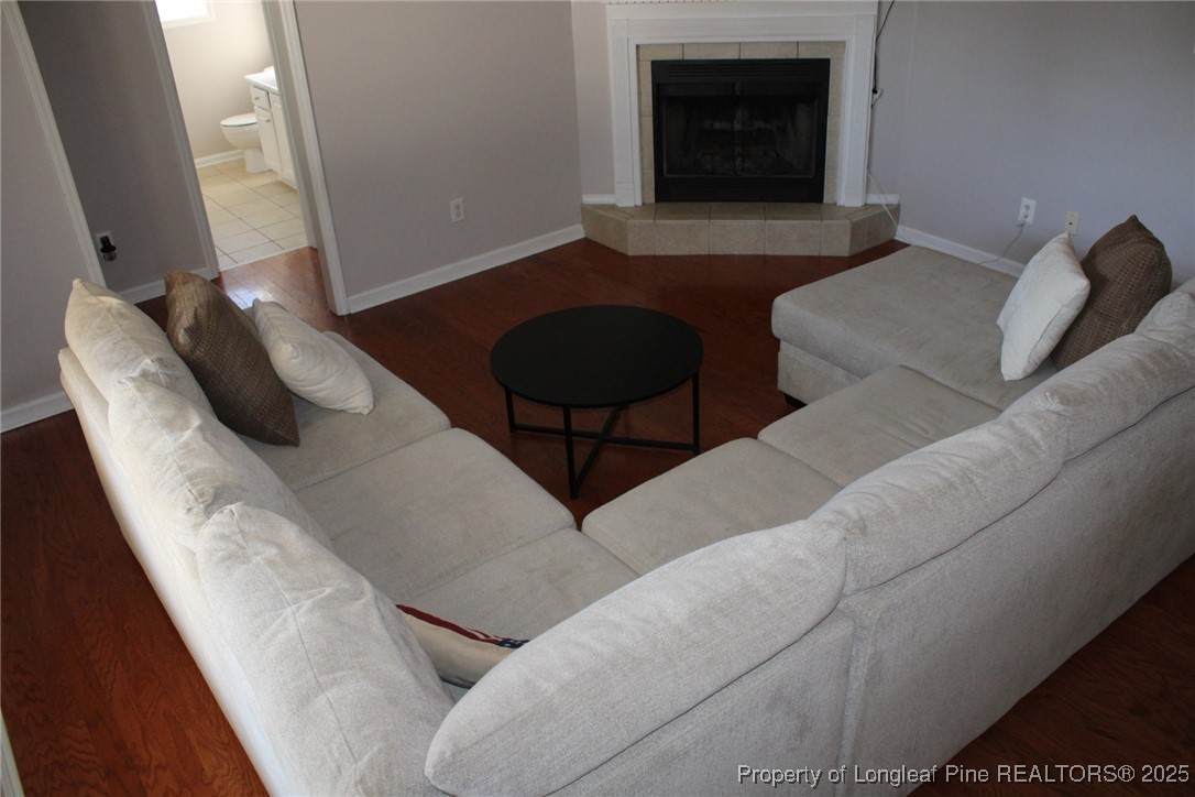 209 Dolphin Drive Raeford, NC 28376 - Photo 25 of 30 a living room with furniture and a fireplace