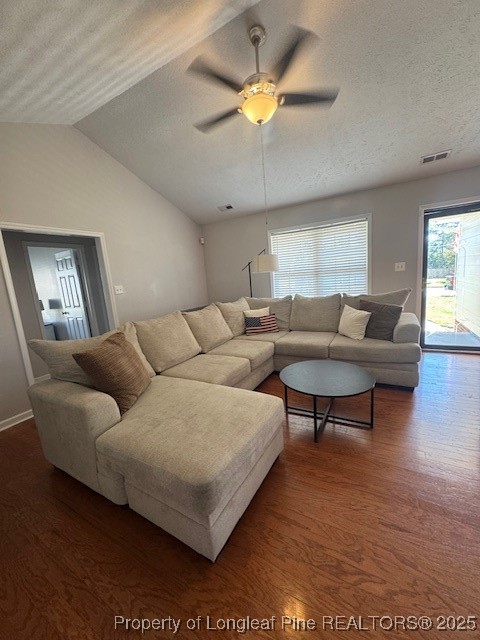209 Dolphin Drive Raeford, NC 28376 - Photo 3 of 30 a living room with furniture wooden floor and a ceiling fan