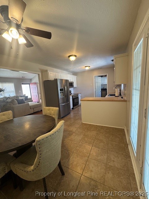 209 Dolphin Drive Raeford, NC 28376 - Photo 5 of 30 a living room with couches and kitchen view with wooden floor