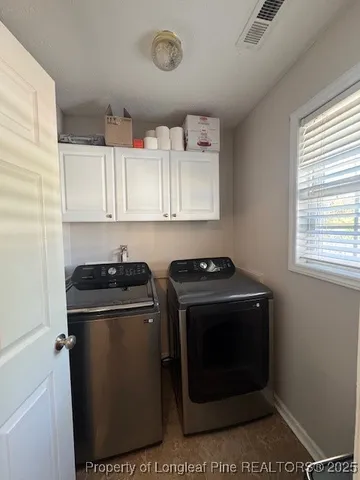 a stove top oven sitting inside of a kitchen