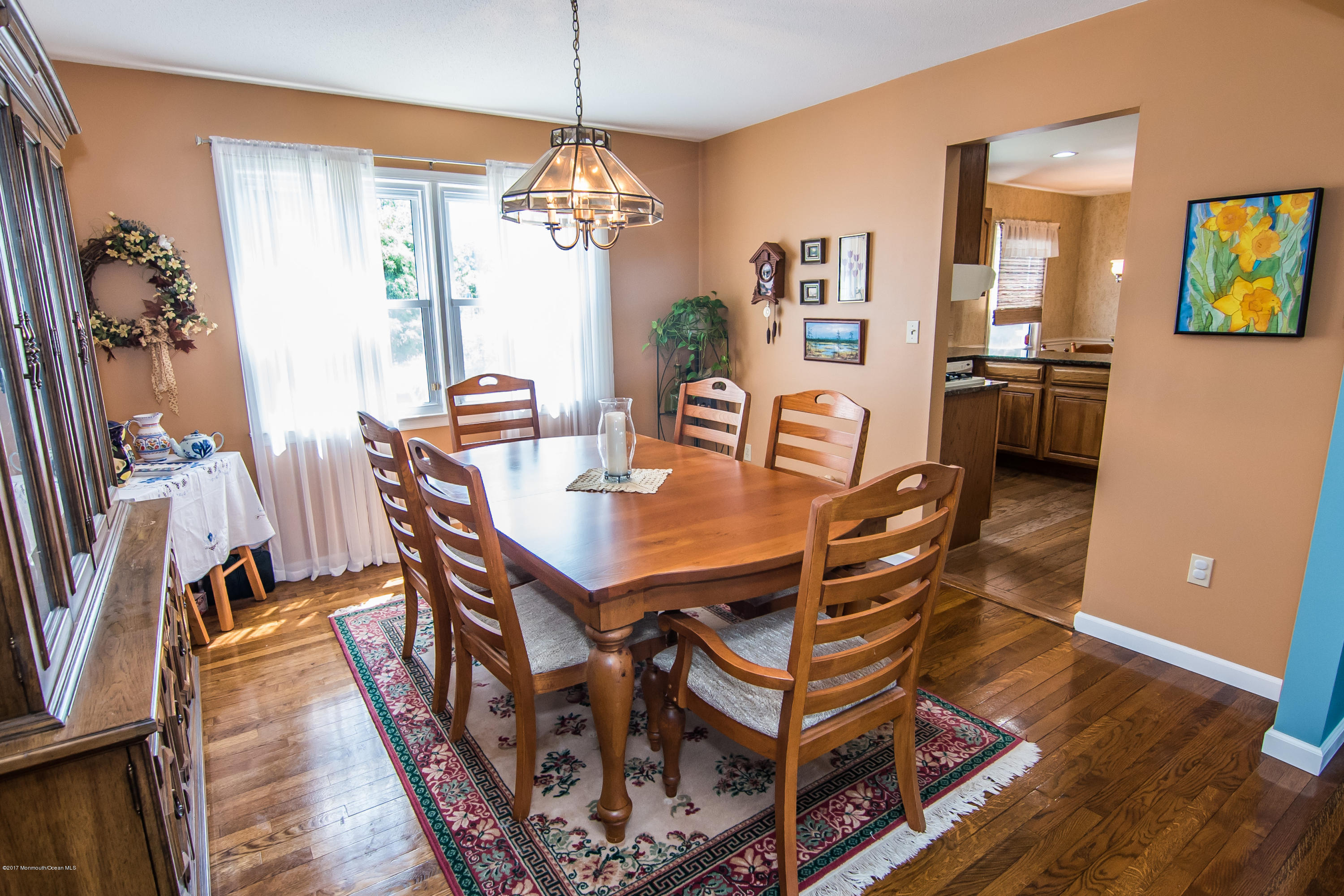 22 Old Post Road Freehold, NJ 07728 - Photo 11 of 61 a view of a dining room with furniture and chandelier