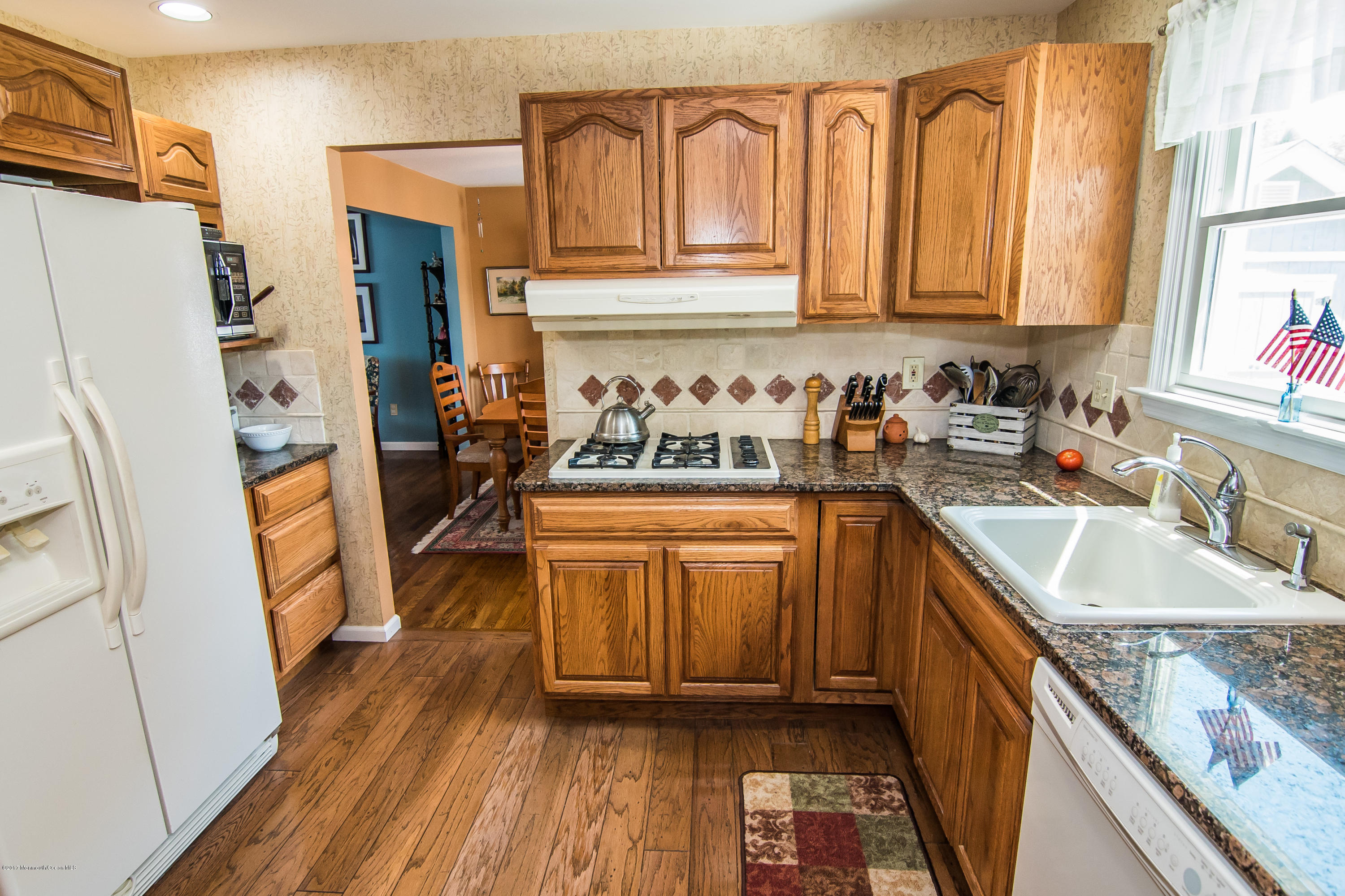 22 Old Post Road Freehold, NJ 07728 - Photo 22 of 61 a kitchen with stainless steel appliances granite countertop a refrigerator stove and sink