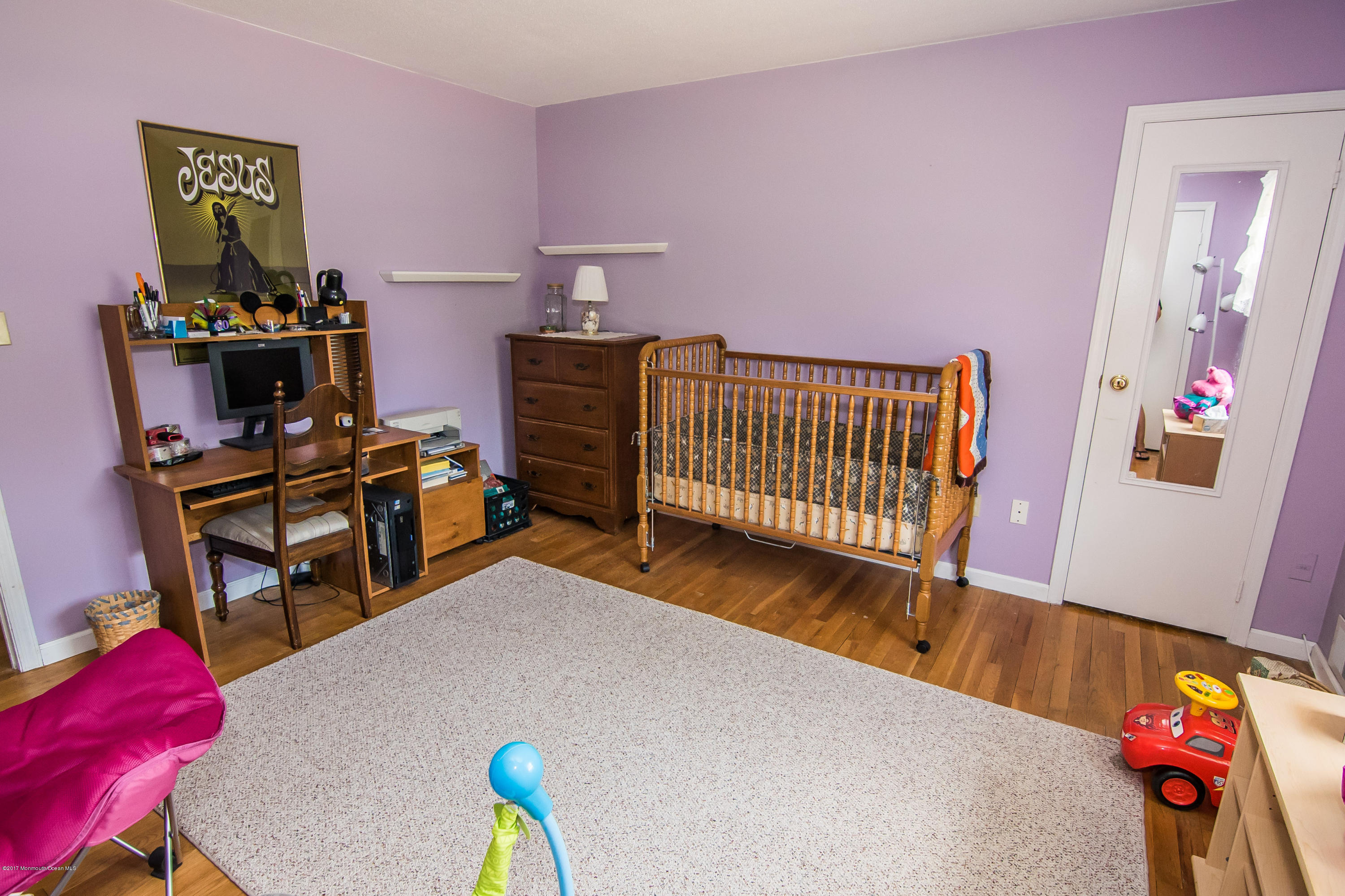22 Old Post Road Freehold, NJ 07728 - Photo 26 of 61 a bedroom with furniture and a wooden floor