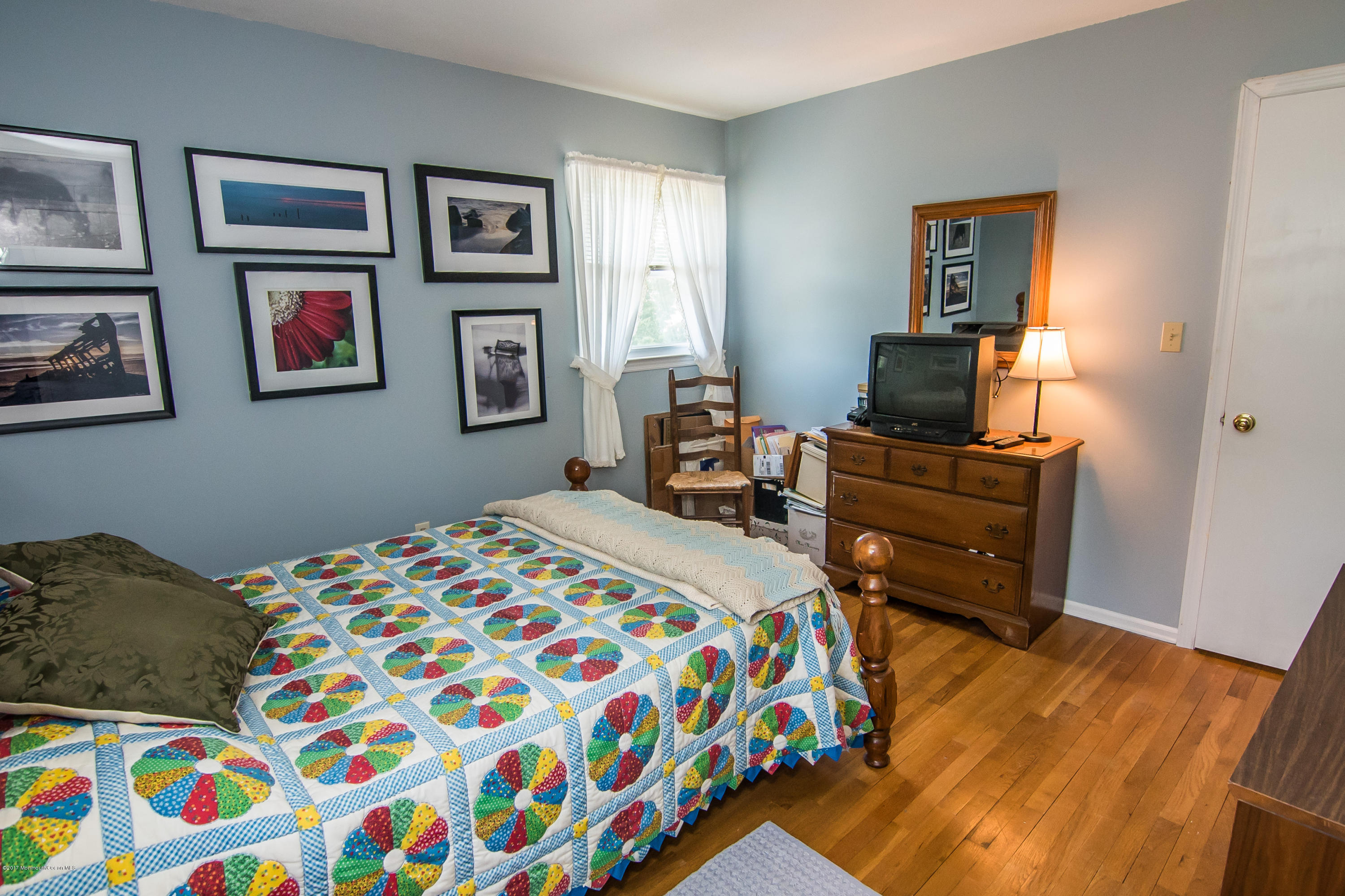 22 Old Post Road Freehold, NJ 07728 - Photo 30 of 61 a bedroom with a bed and wooden floor