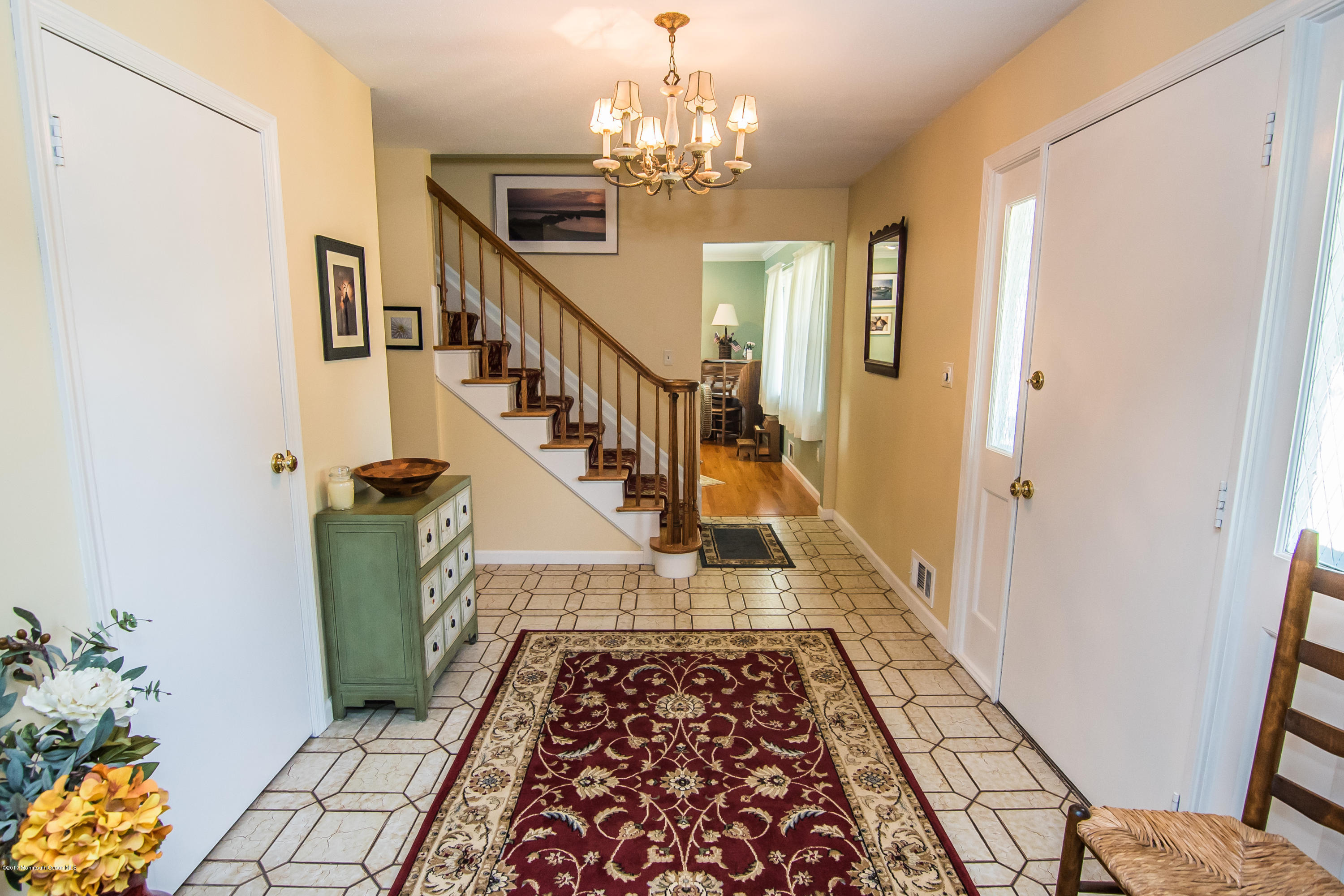 22 Old Post Road Freehold, NJ 07728 - Photo 3 of 61 a view of entryway and hall with wooden floor