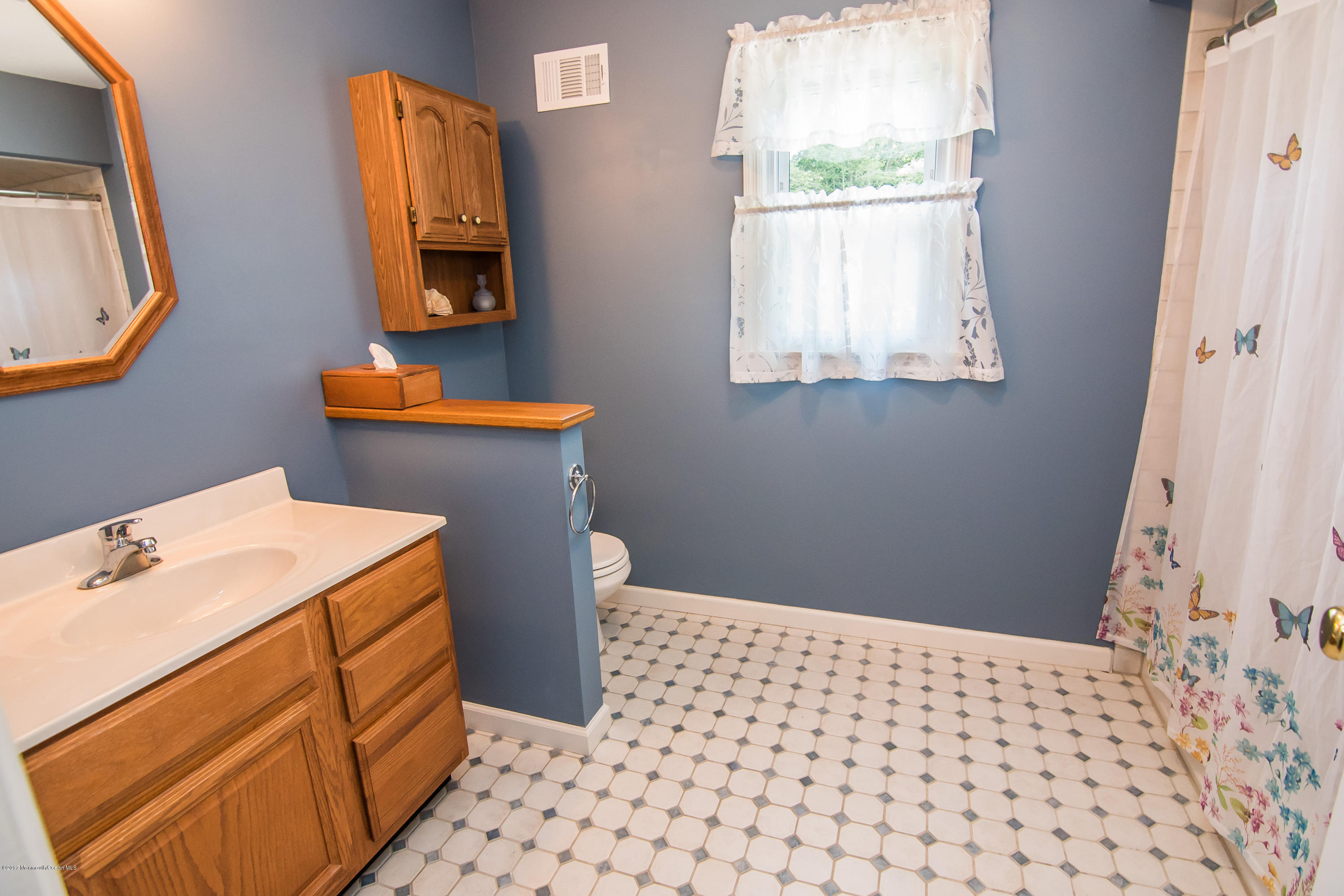22 Old Post Road Freehold, NJ 07728 - Photo 31 of 61 a bathroom with a sink a toilet and mirror